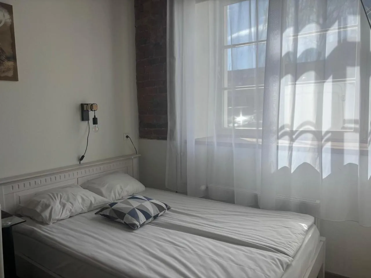 Bed in Filosoofi 1 Studio Apartments