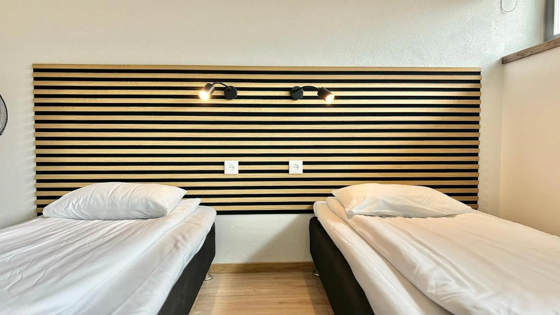Bed in Filosoofi 1 Studio Apartments