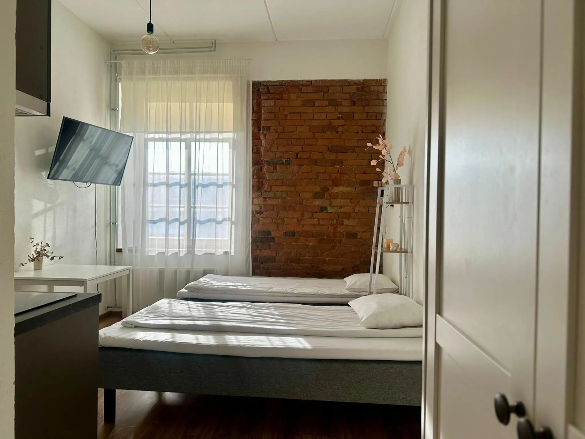 Bed in Filosoofi 1 Studio Apartments