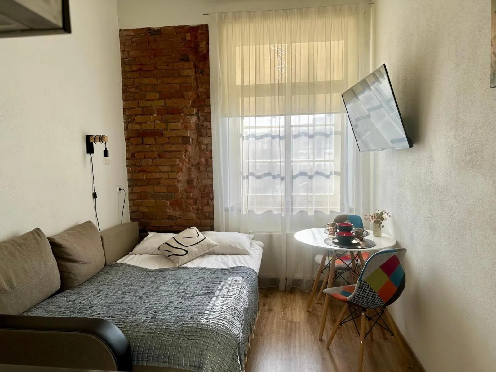 Bed in Filosoofi 1 Studio Apartments