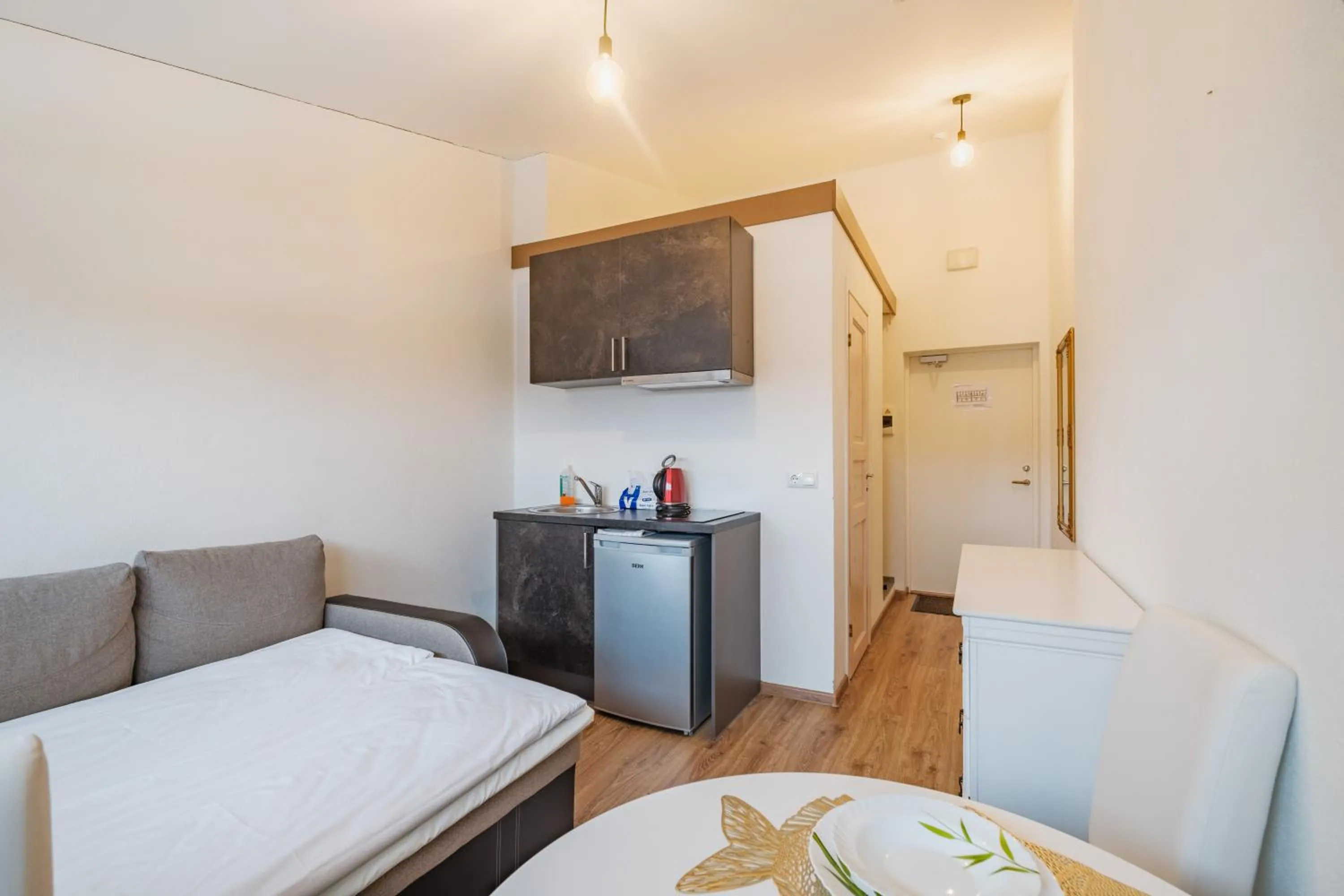Kitchen or kitchenette, Bed in Filosoofi 1 Studio Apartments