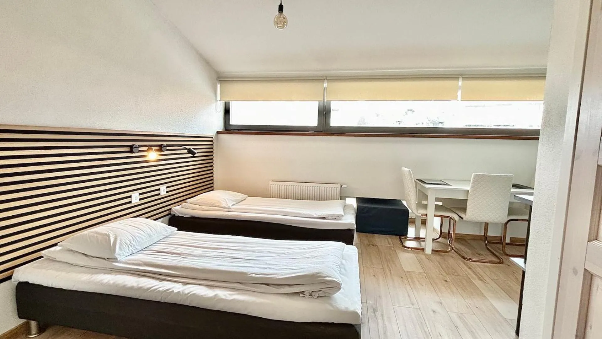 Bed in Filosoofi 1 Studio Apartments