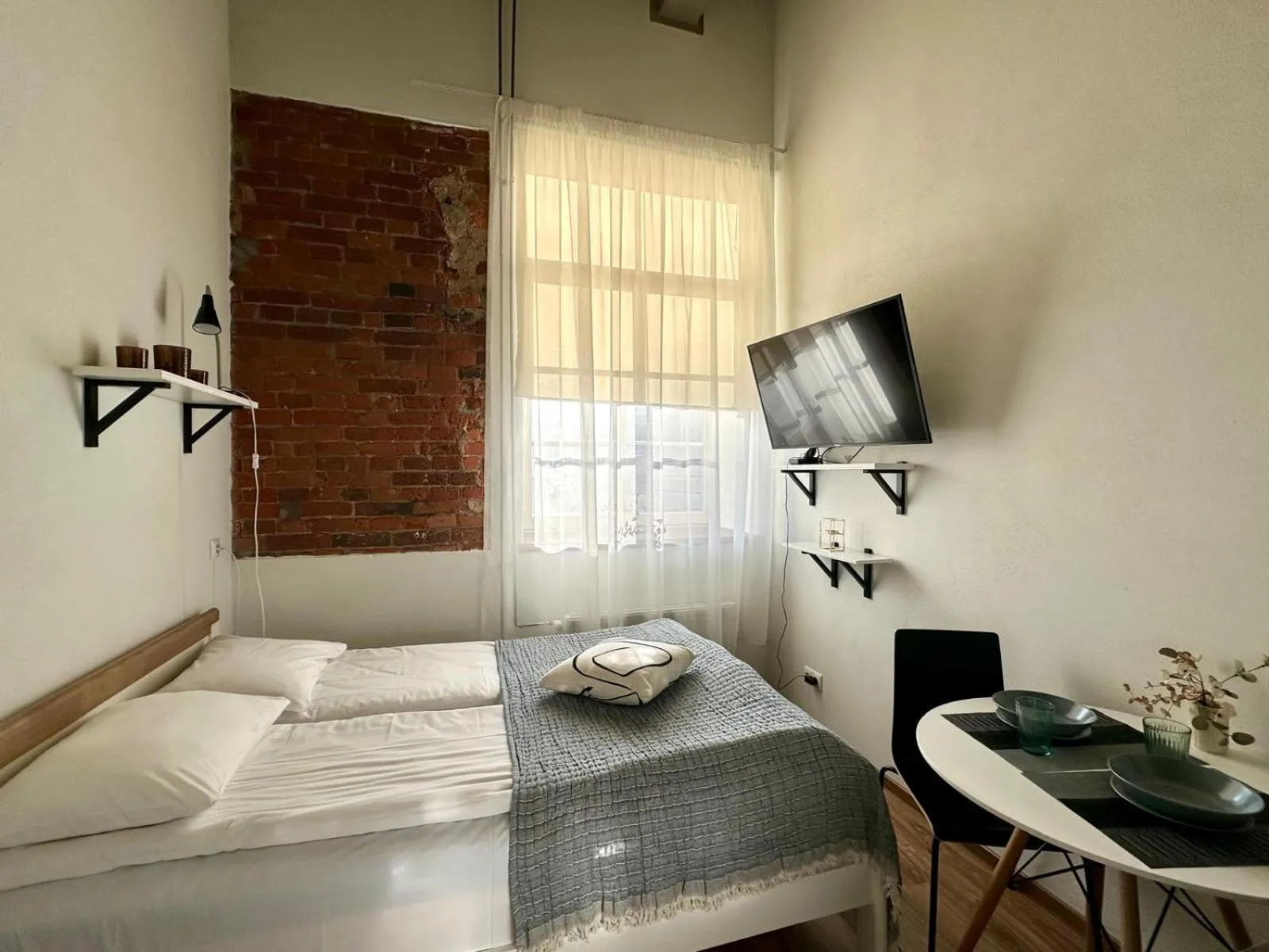 Bed in Filosoofi 1 Studio Apartments