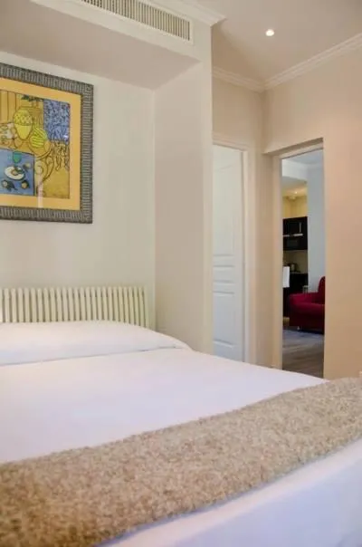 Bed in Emeraude Résidence Hotelière