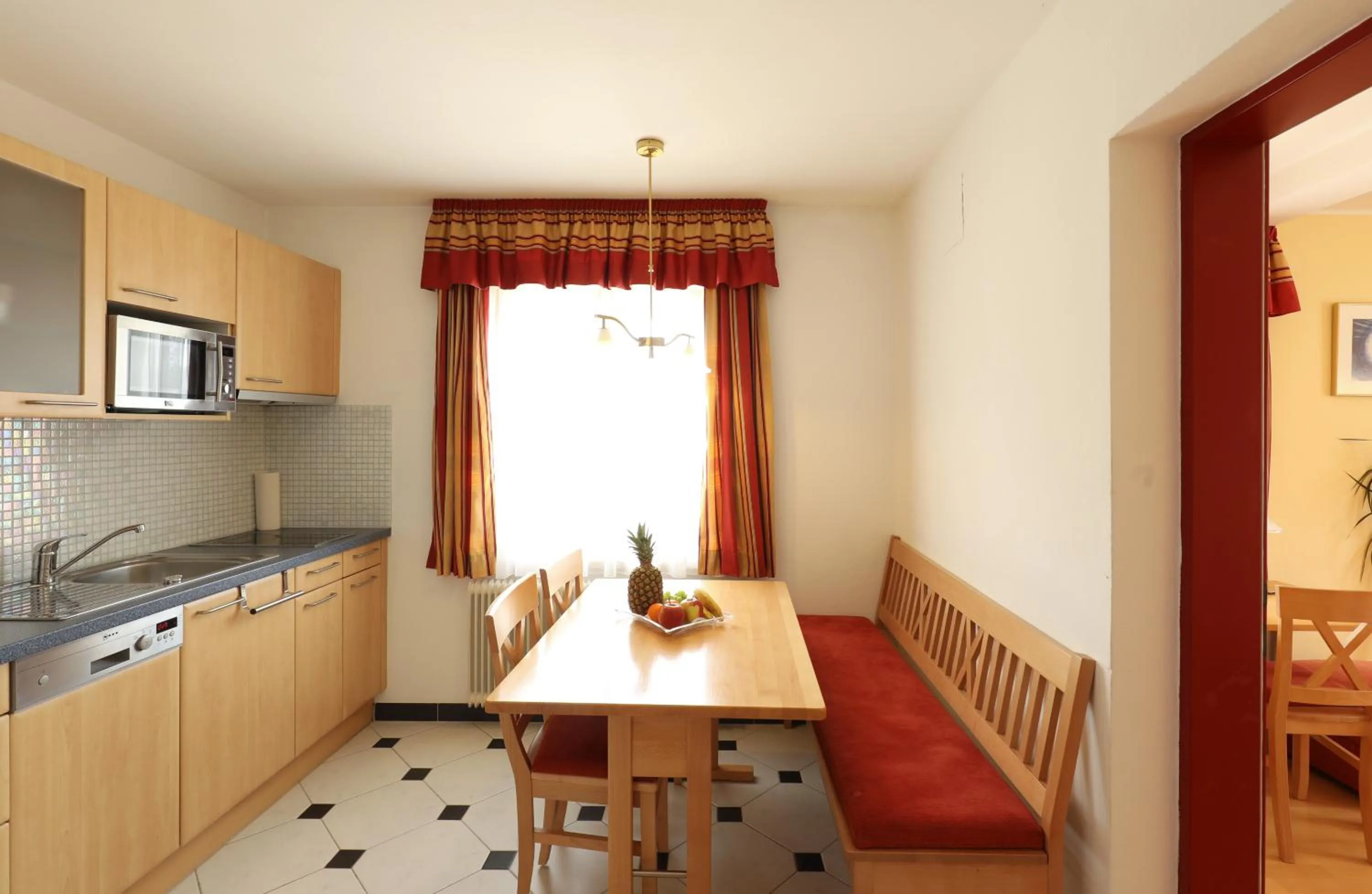 Kitchen or kitchenette in Hotel Garni Dorferwirt am Irrsee