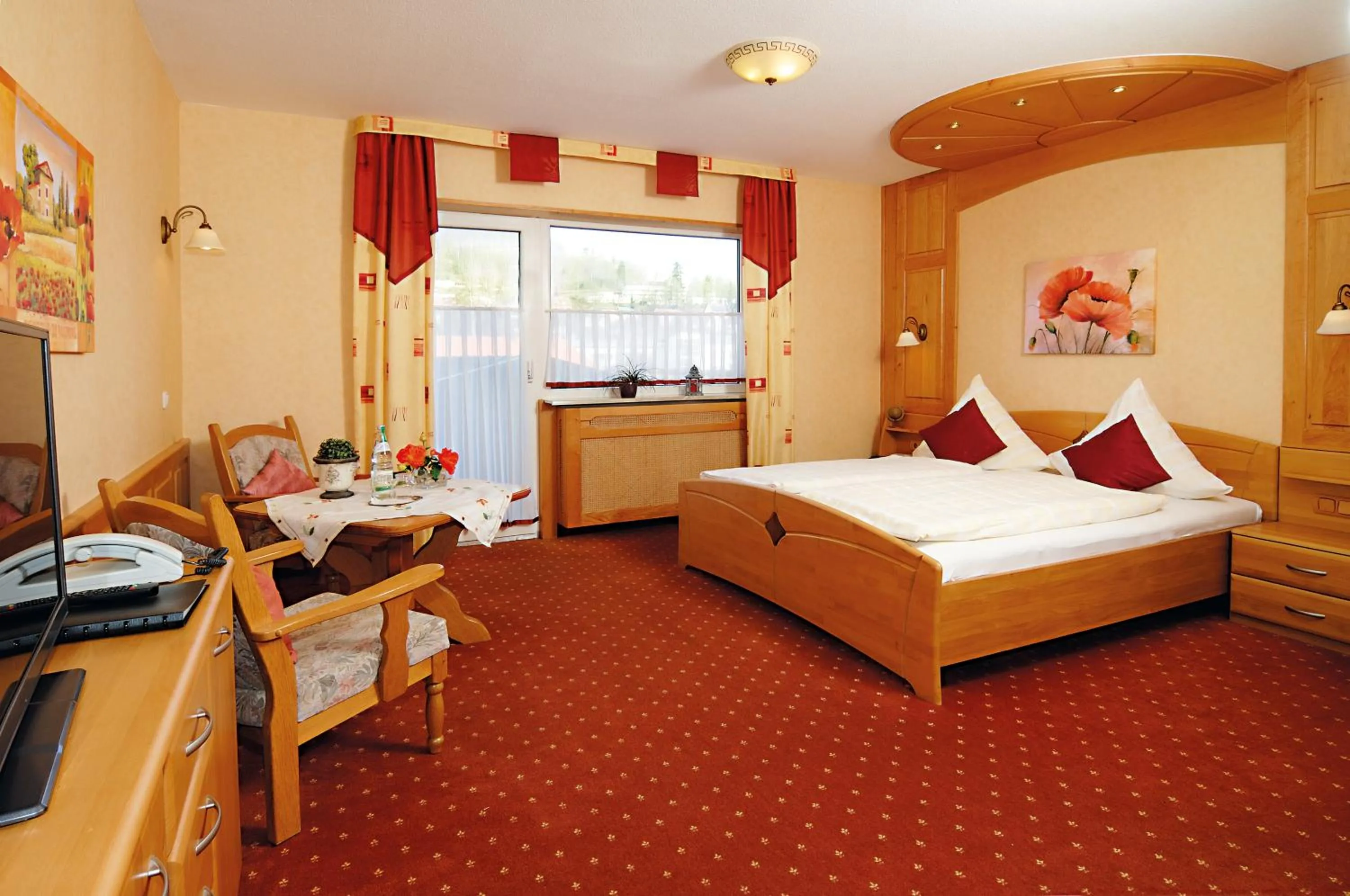 Seating area, Bed in Hotel Ursula Garni