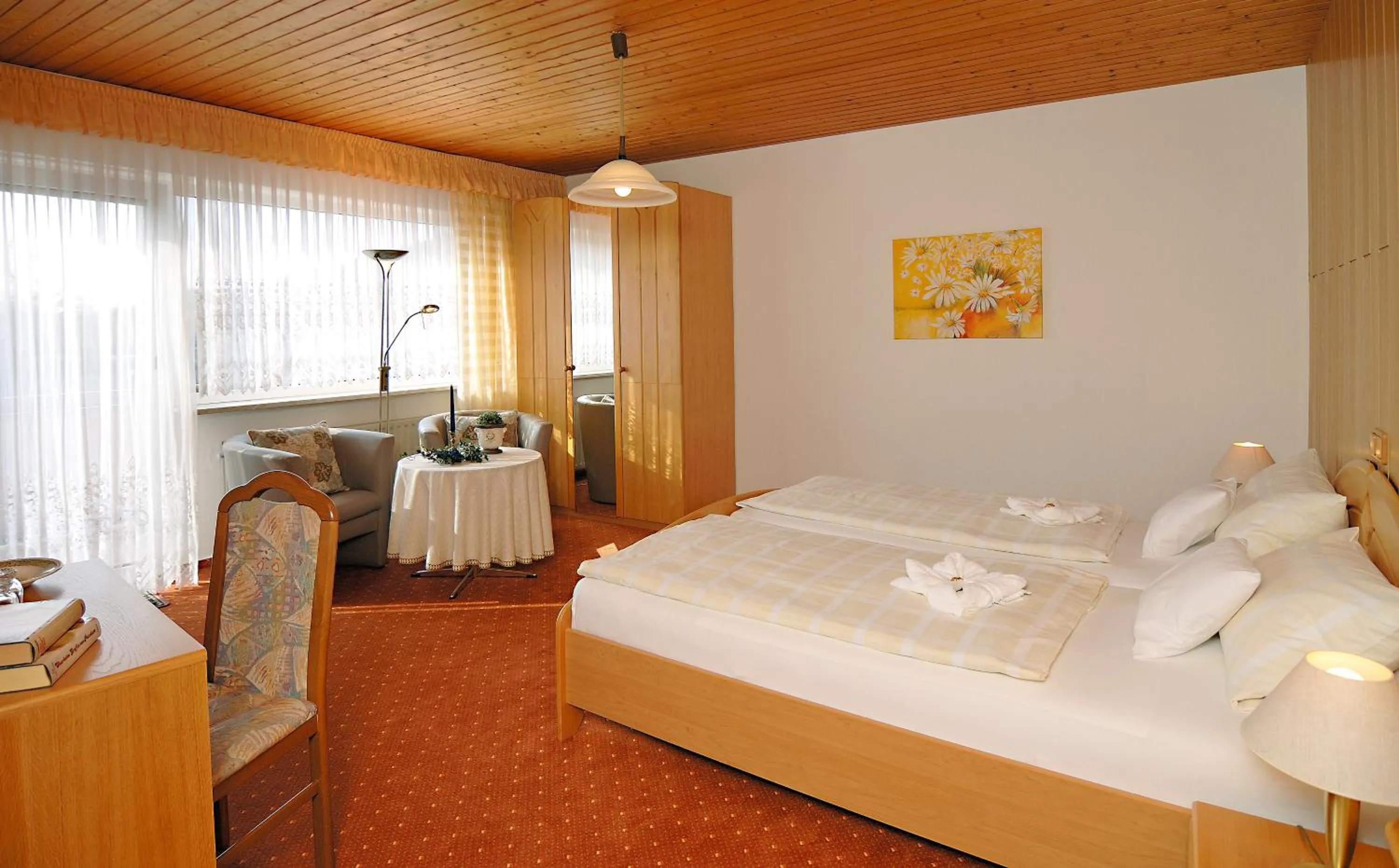 Seating area, Bed in Hotel Ursula Garni