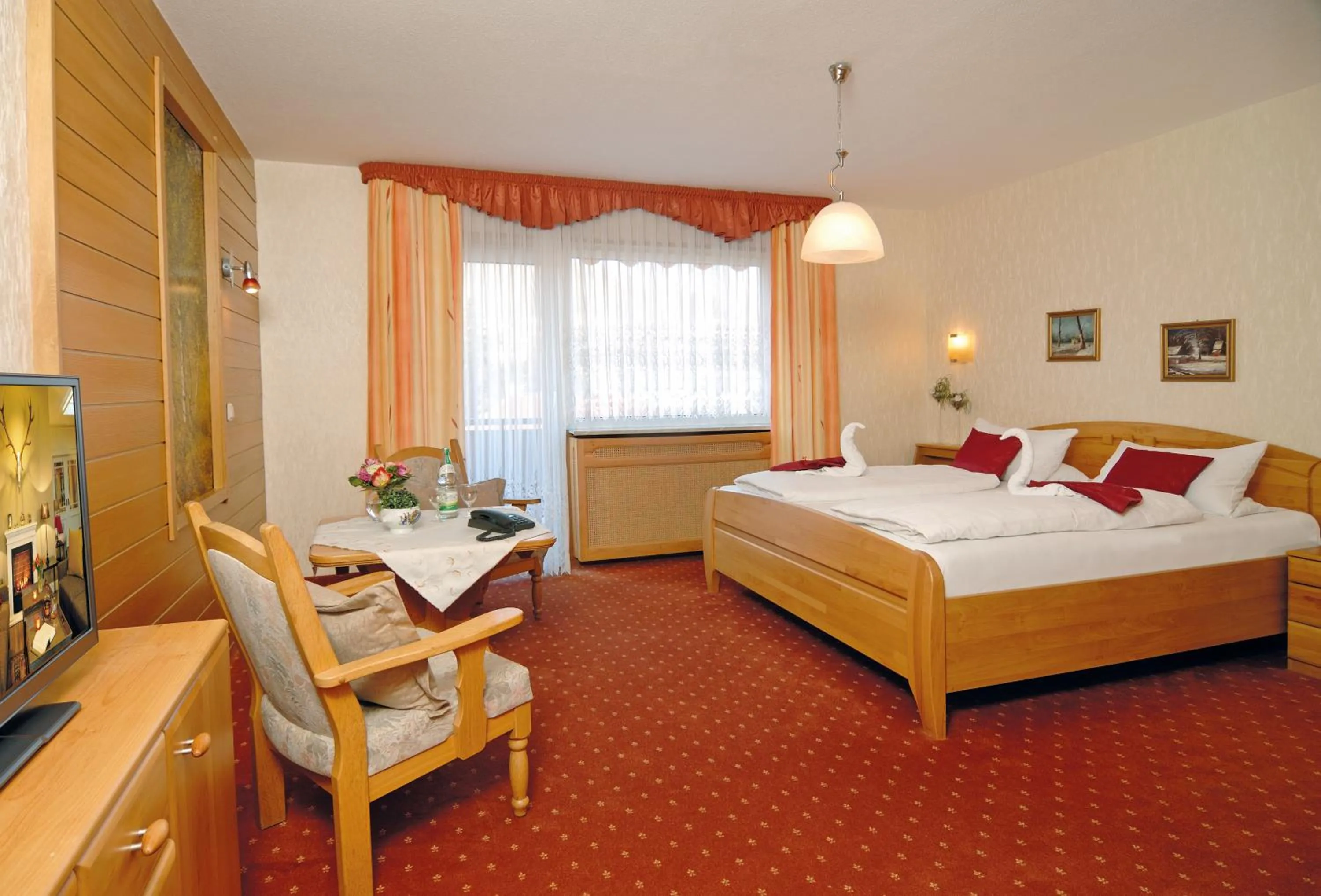 Seating area, Bed in Hotel Ursula Garni