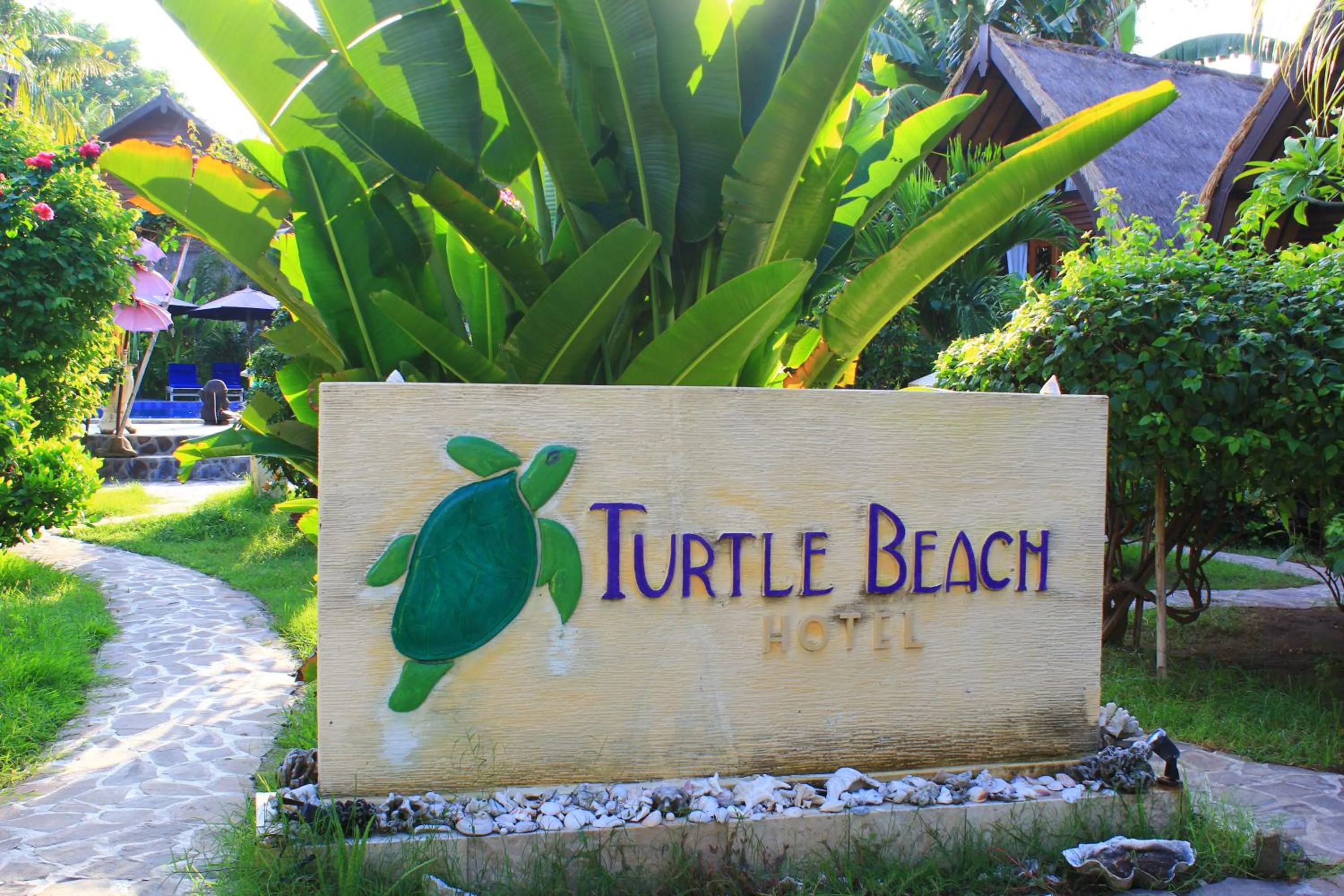 Property logo or sign in Turtle Beach Hotel