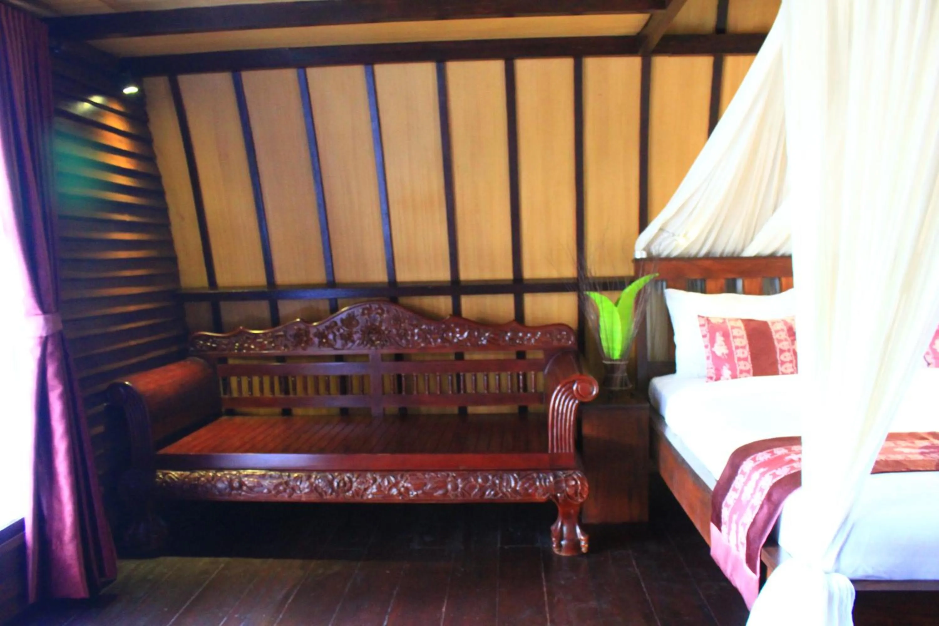 Seating area, Bed in Turtle Beach Hotel