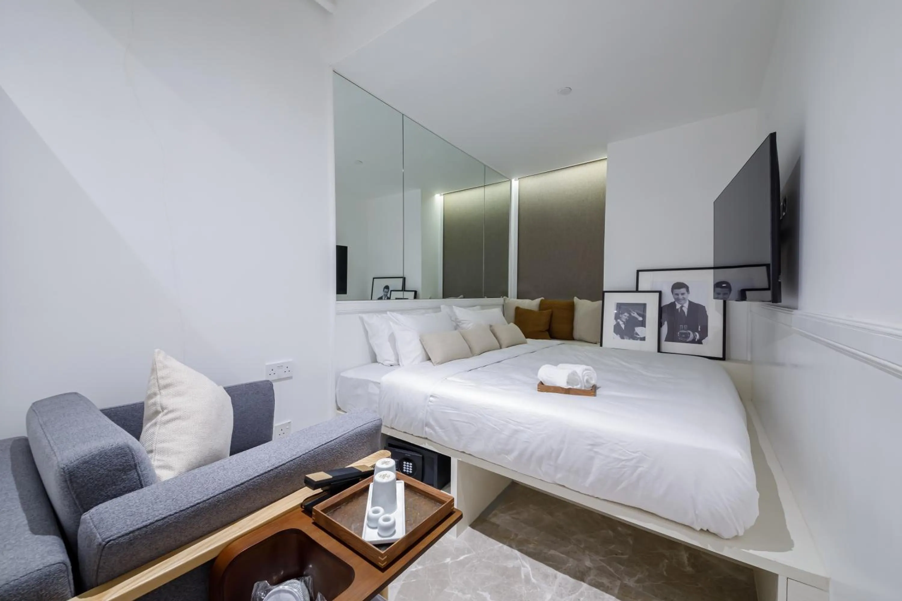 Seating area, Bed in Charterhouse Causeway Bay