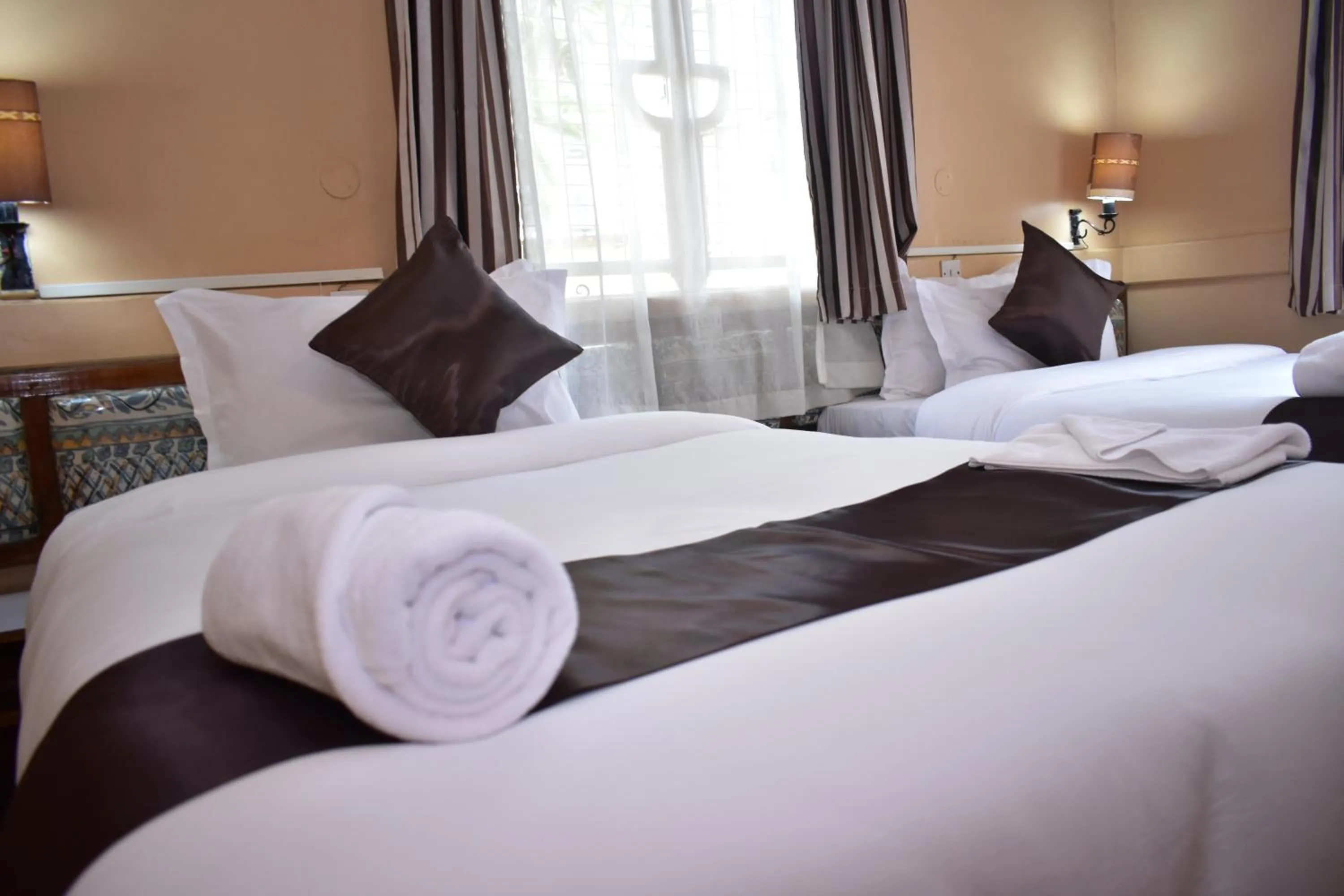 Bed in Impala Hotel Parklands