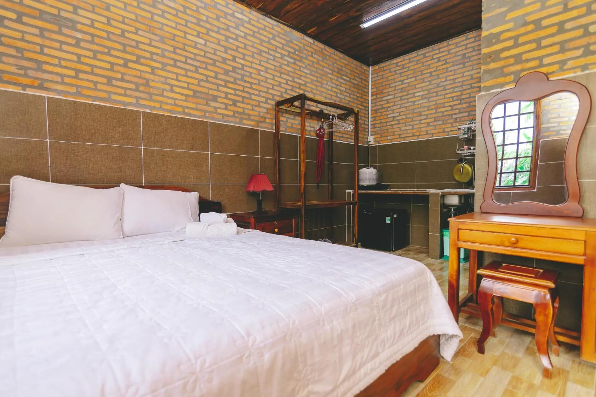 Bed in CASA ECO Mekong Resort