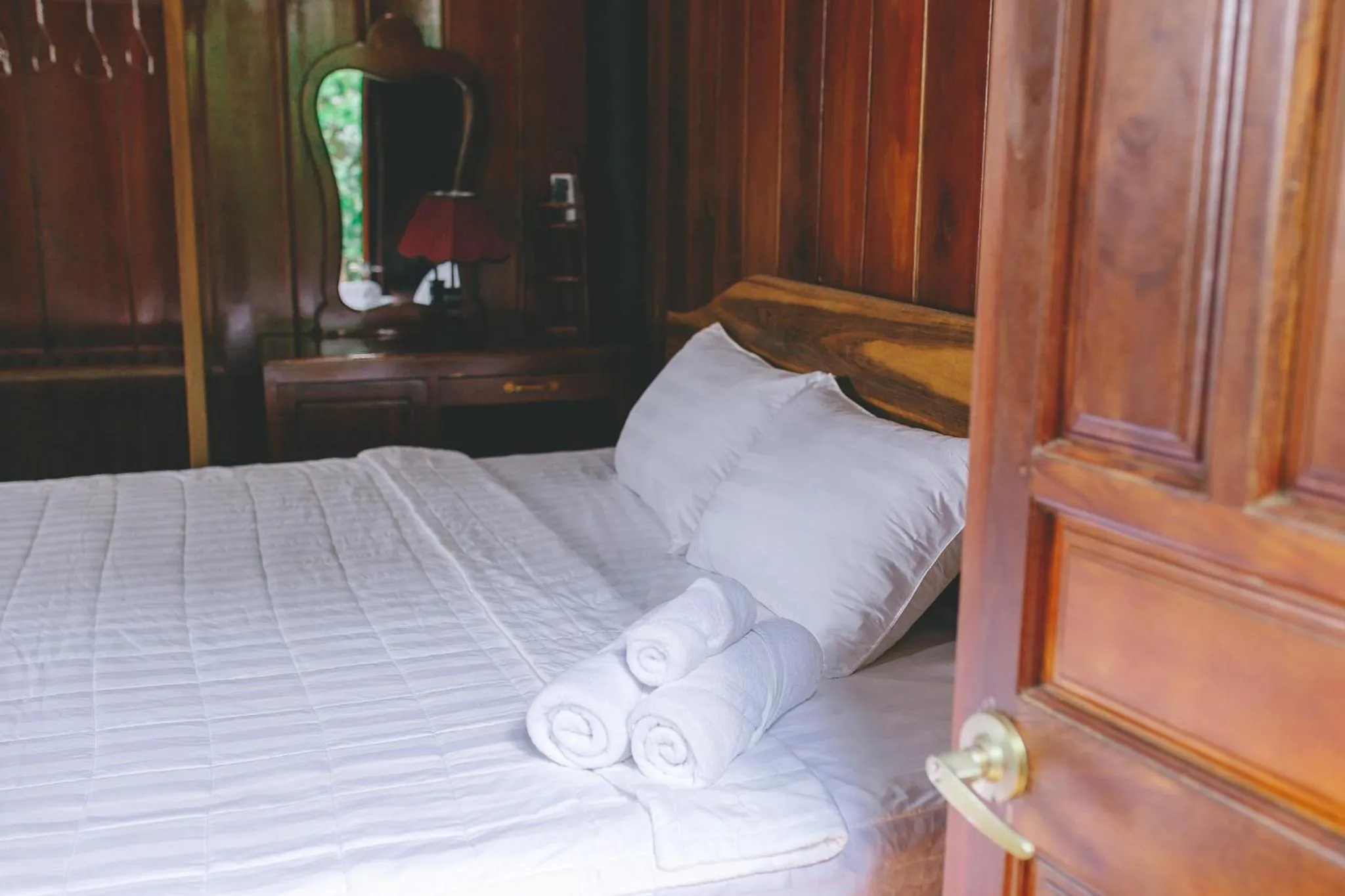 Bed in CASA ECO Mekong Resort