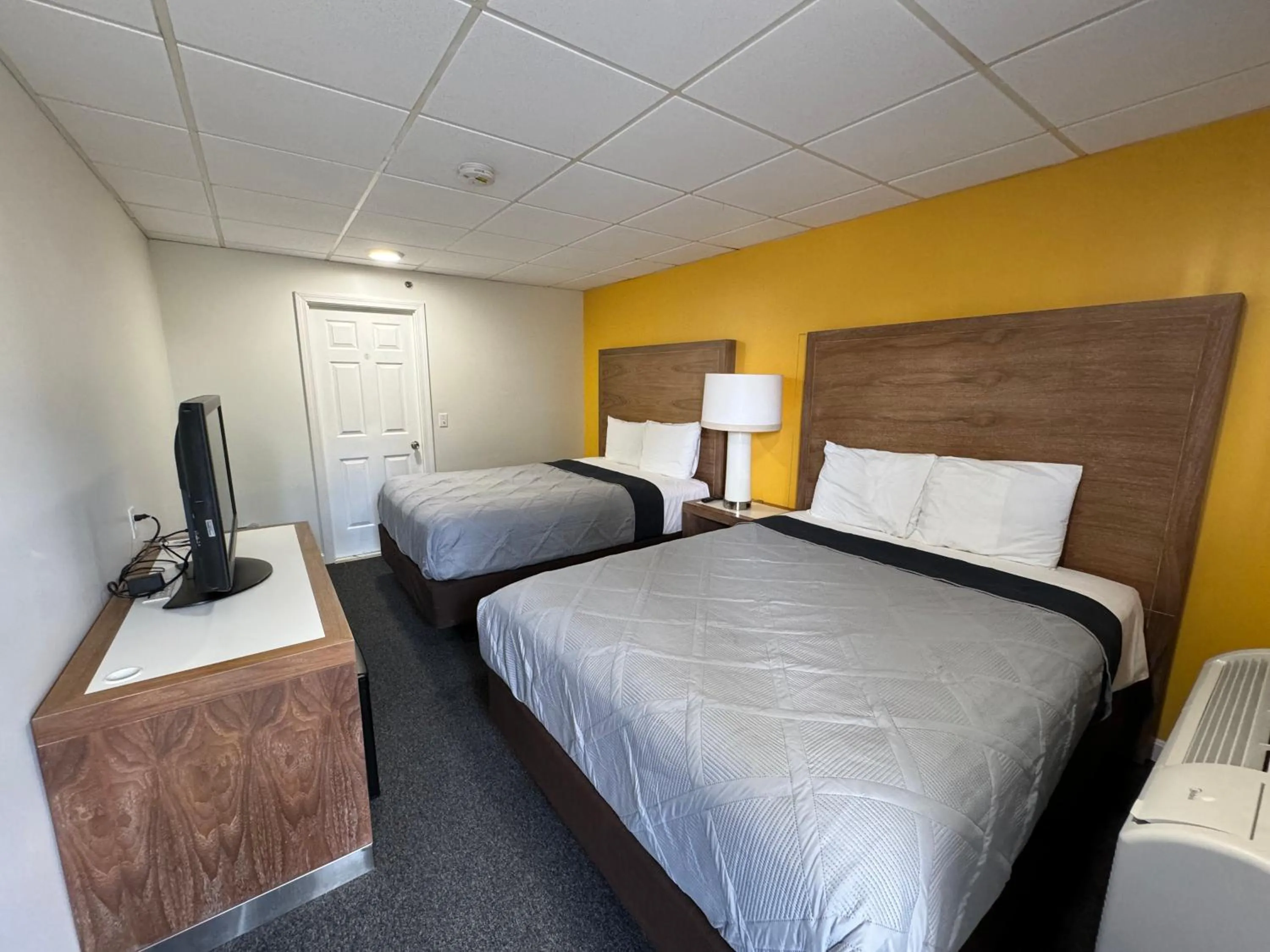 Bed in Winnisquam Lake Inn