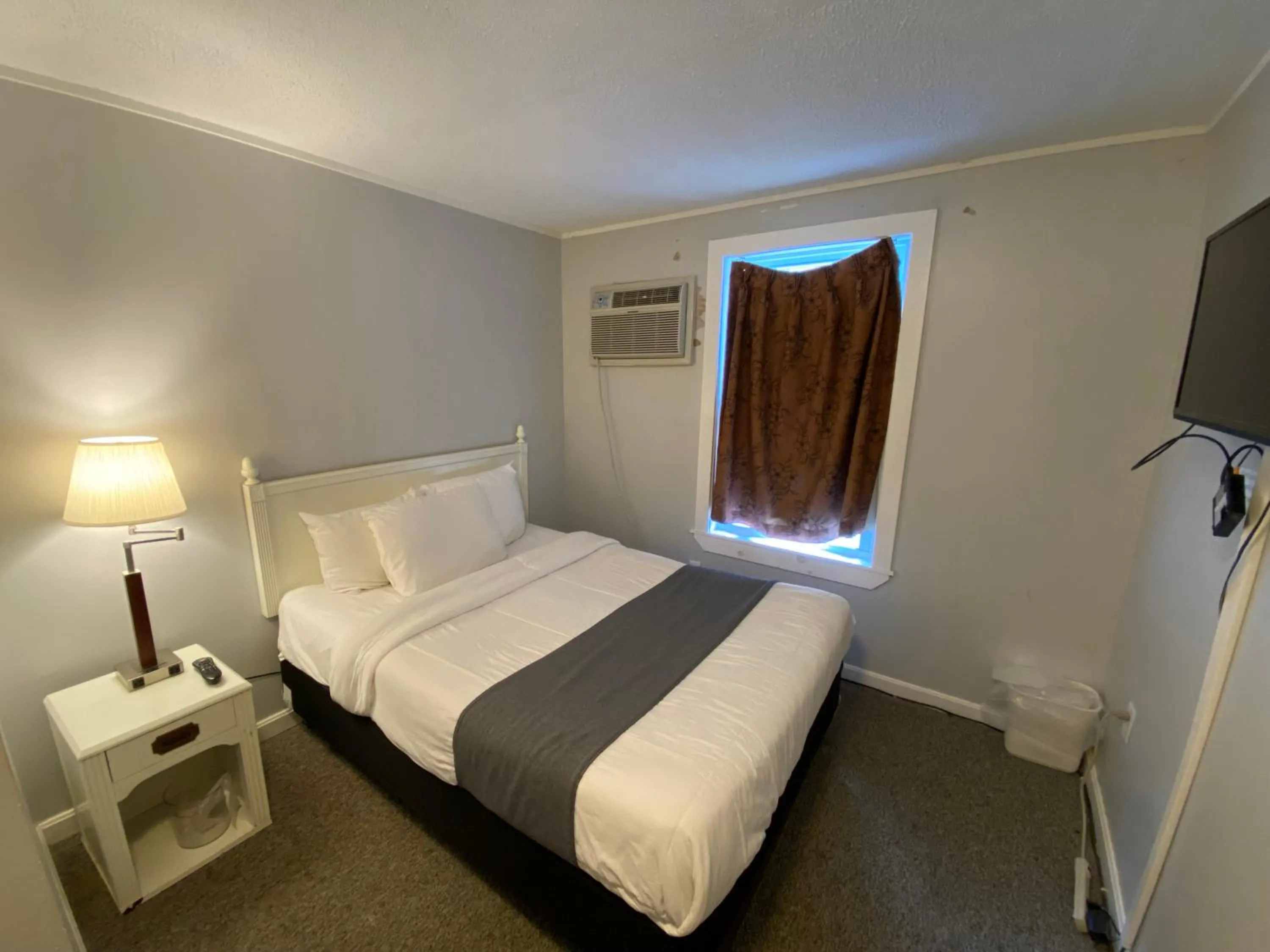 Bed in Winnisquam Lake Inn