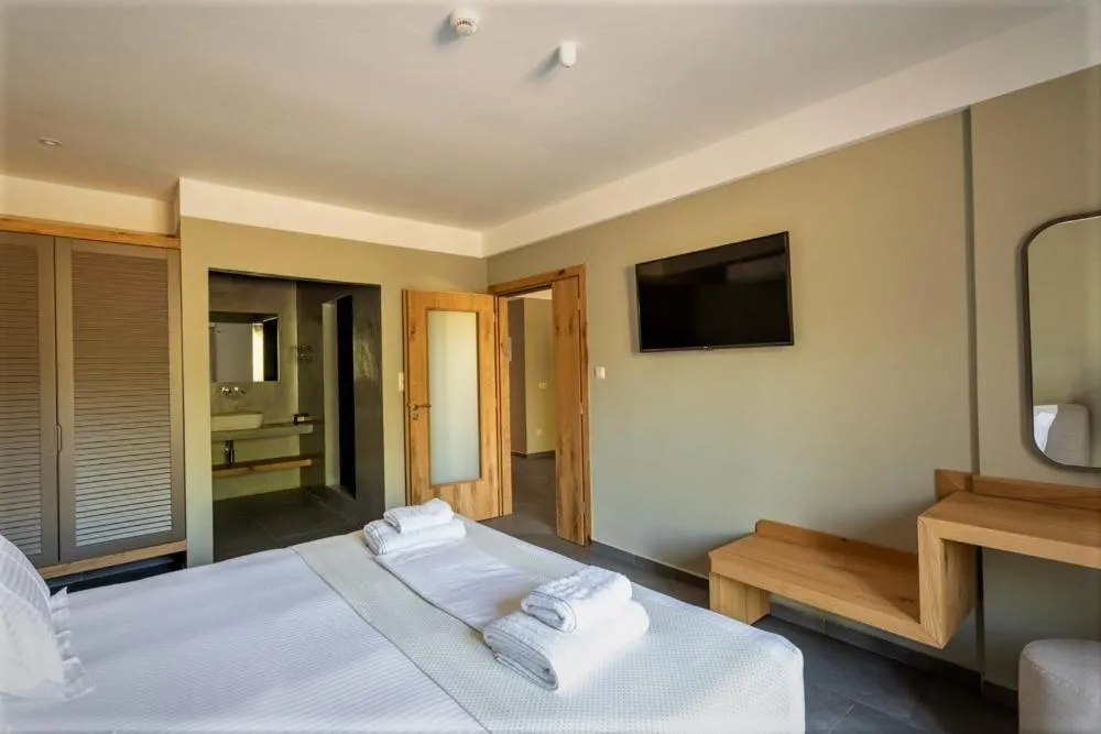 Bed in Diapori Suites Hotel
