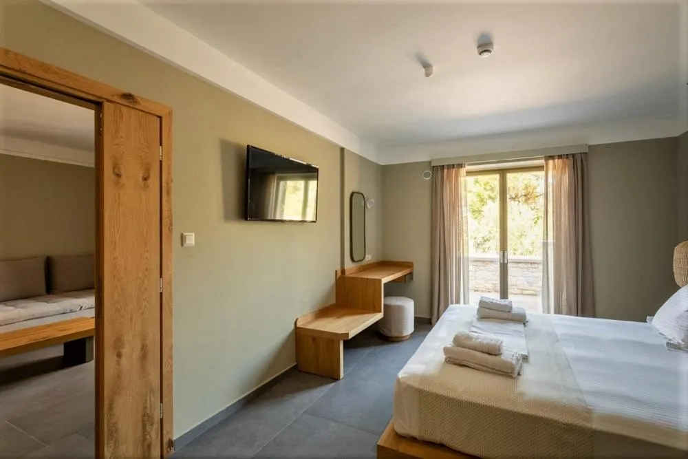 Photo of the whole room, Bed in Diapori Suites Hotel