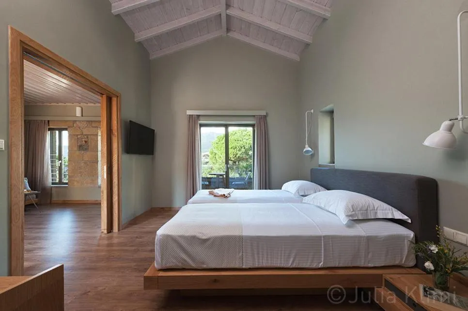 Bed in Diapori Suites Hotel