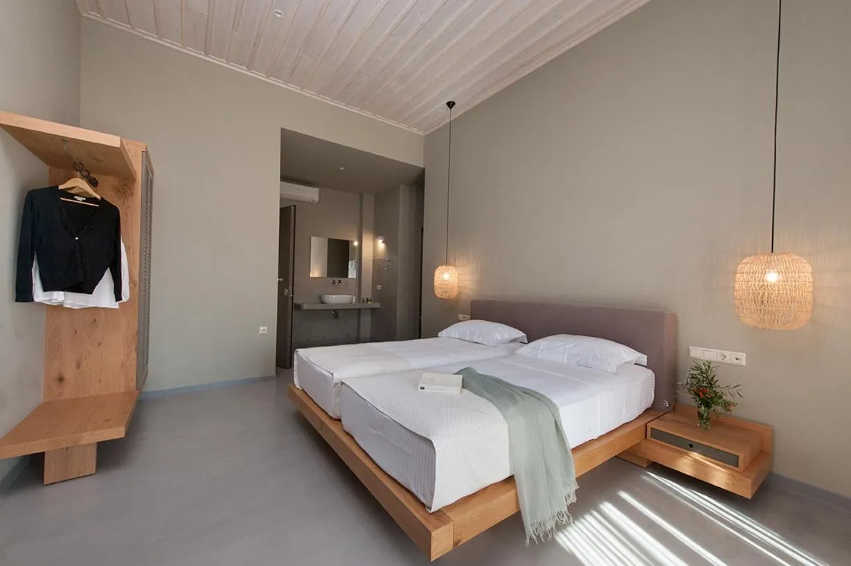 Bed in Diapori Suites Hotel