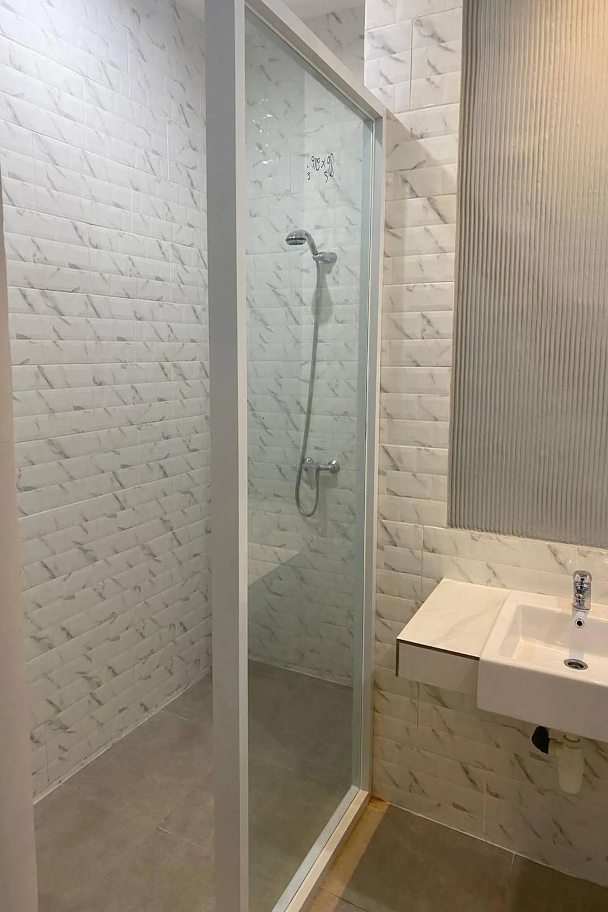 Bathroom in Gemini Star Hotel Kuta