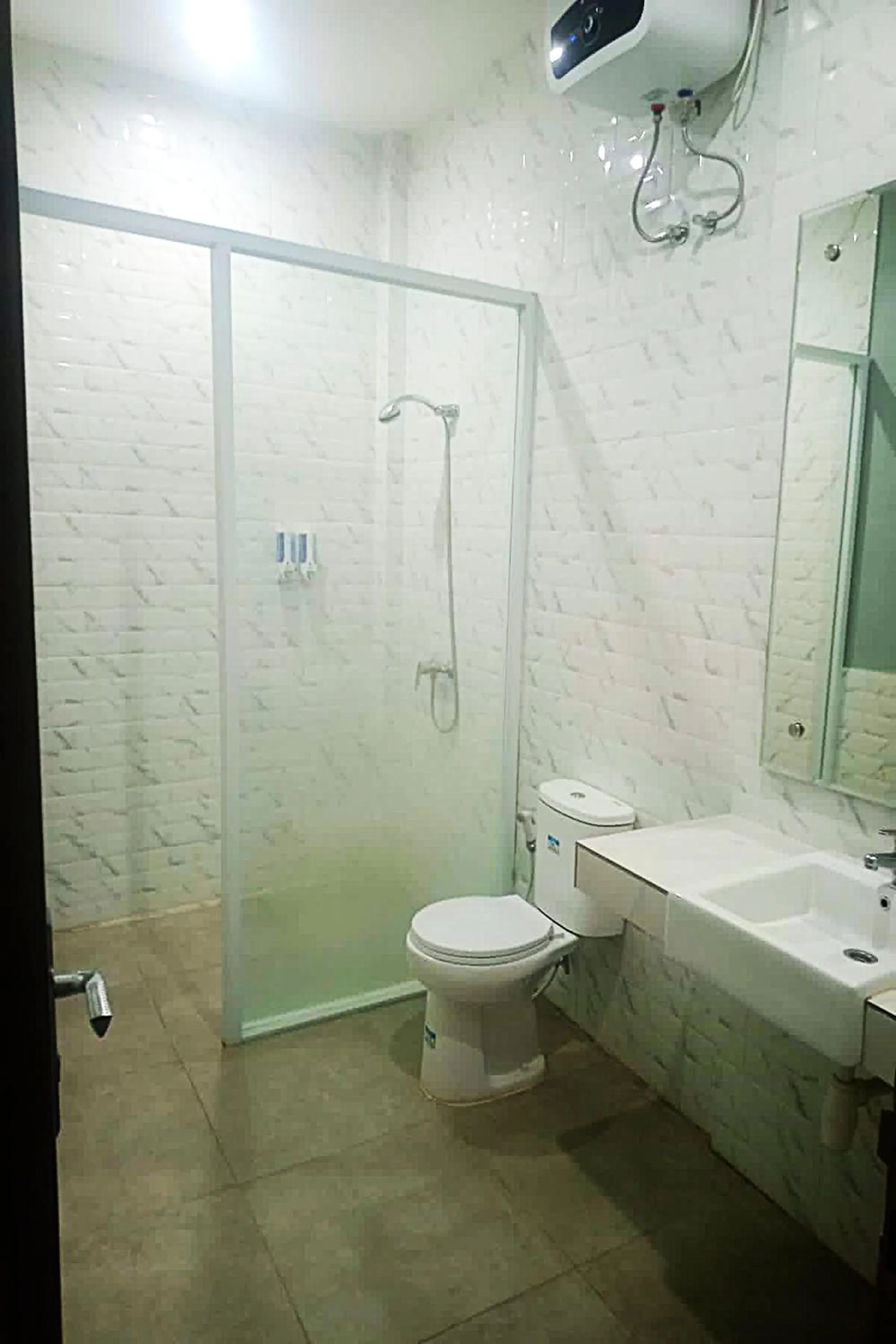 Bathroom in Gemini Star Hotel Kuta