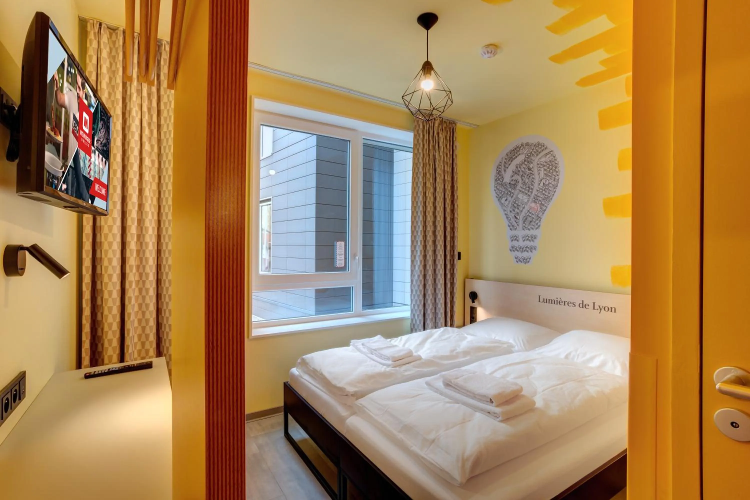 Photo of the whole room, Bed in MEININGER Hotel Lyon Centre Berthelot