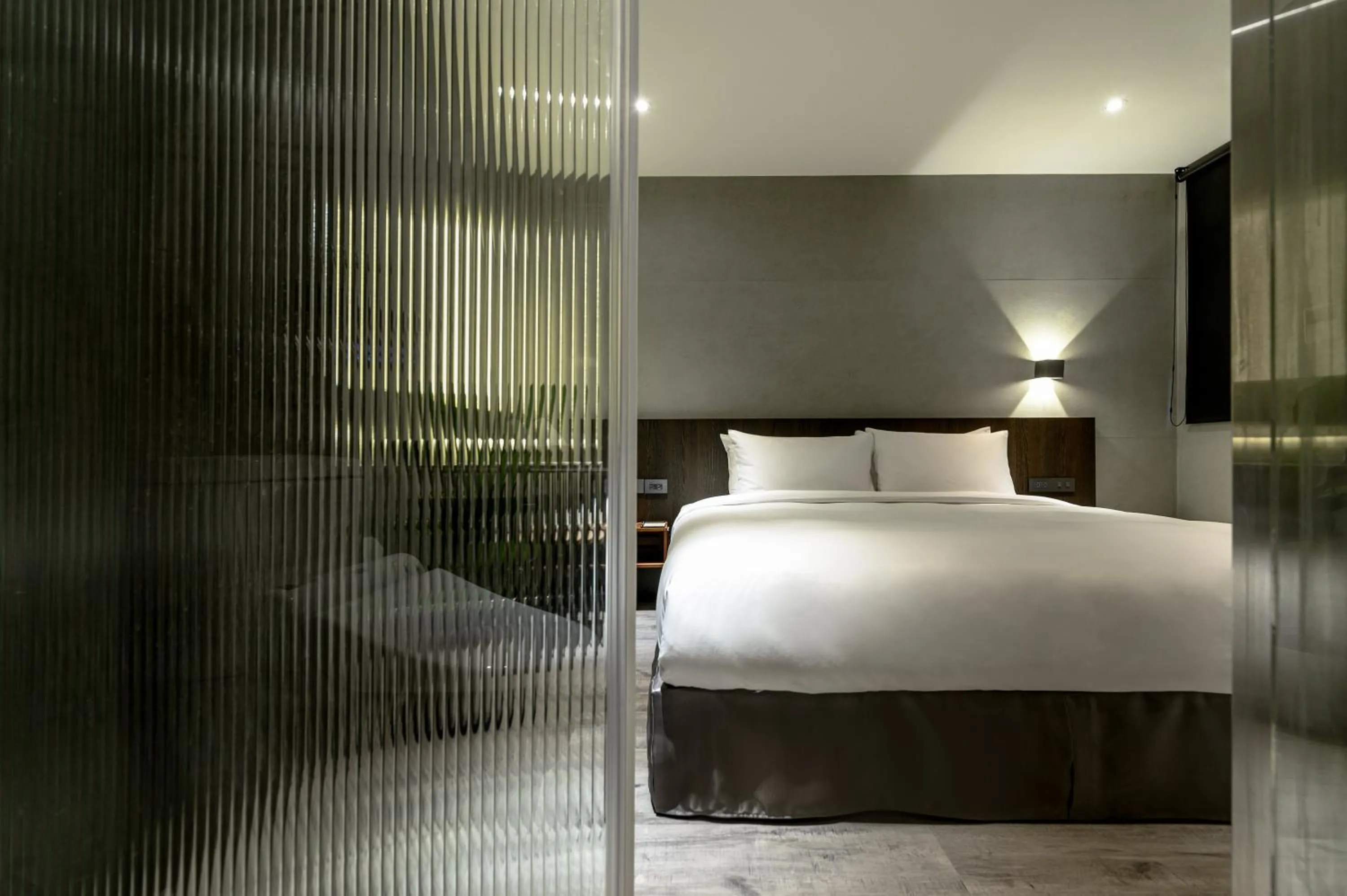 Bed in Yunoyado Onsen Hot Spring Hotel Deyang