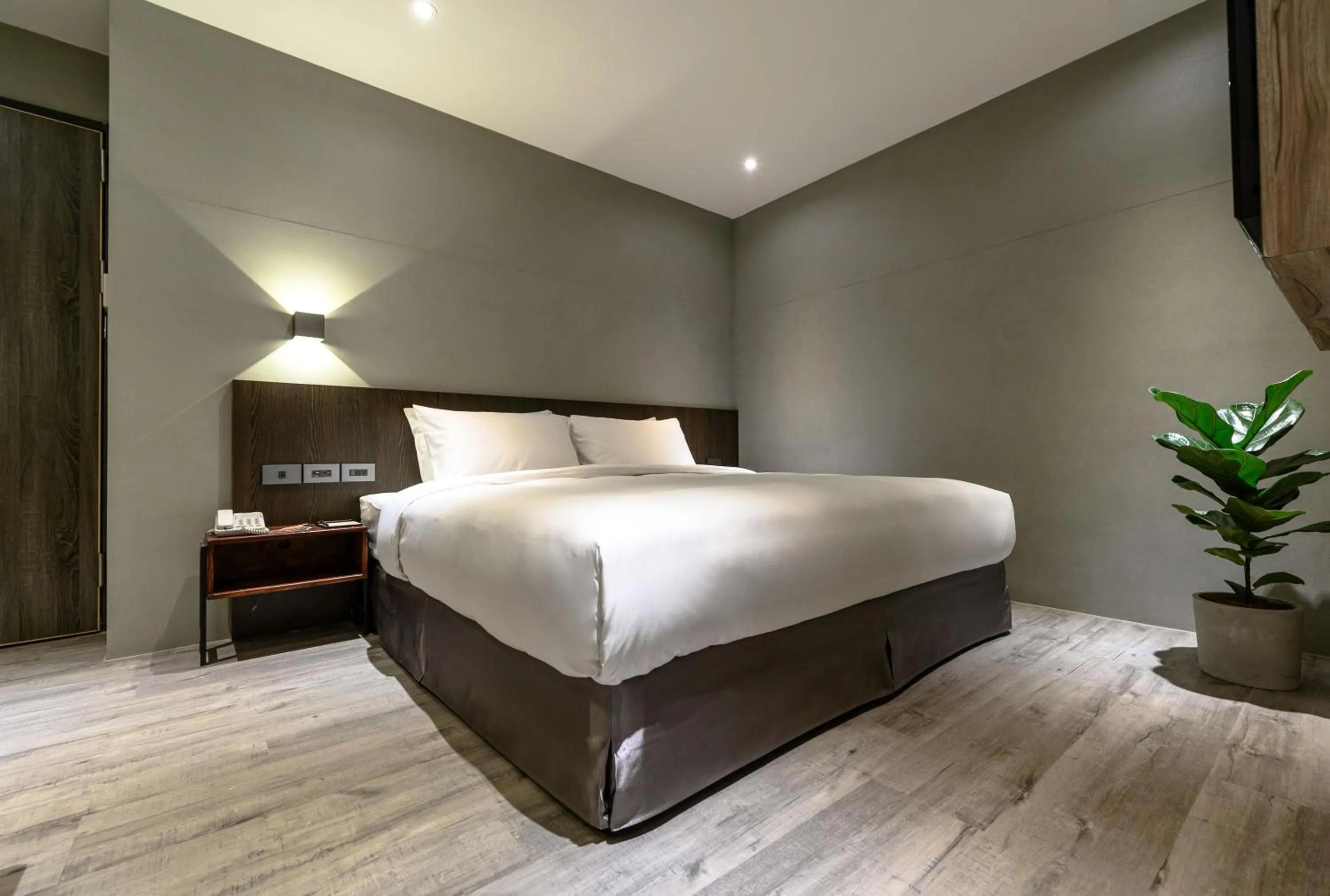 Bed in Yunoyado Onsen Hot Spring Hotel Deyang