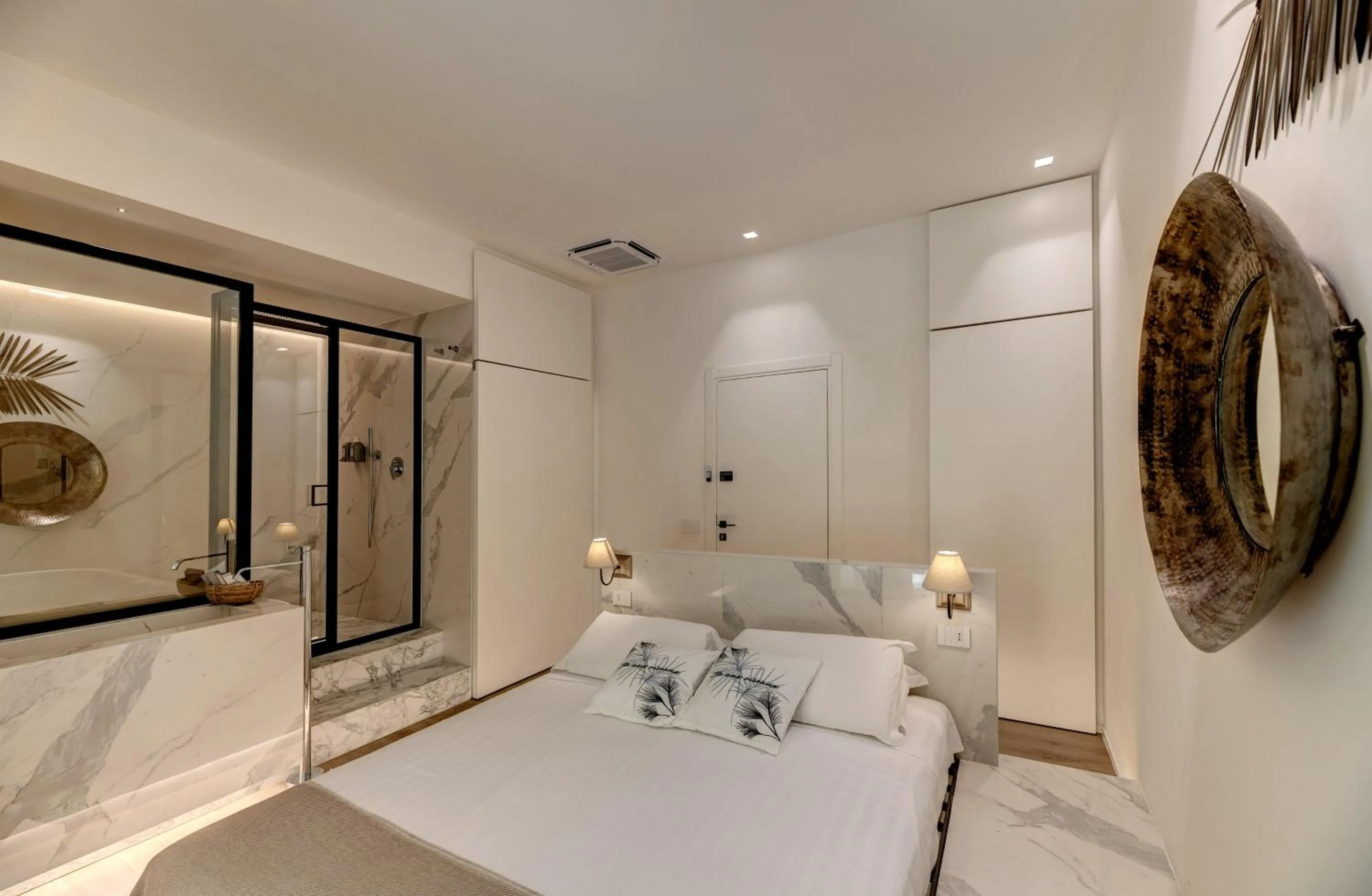 Bed in Le Palmette Suites