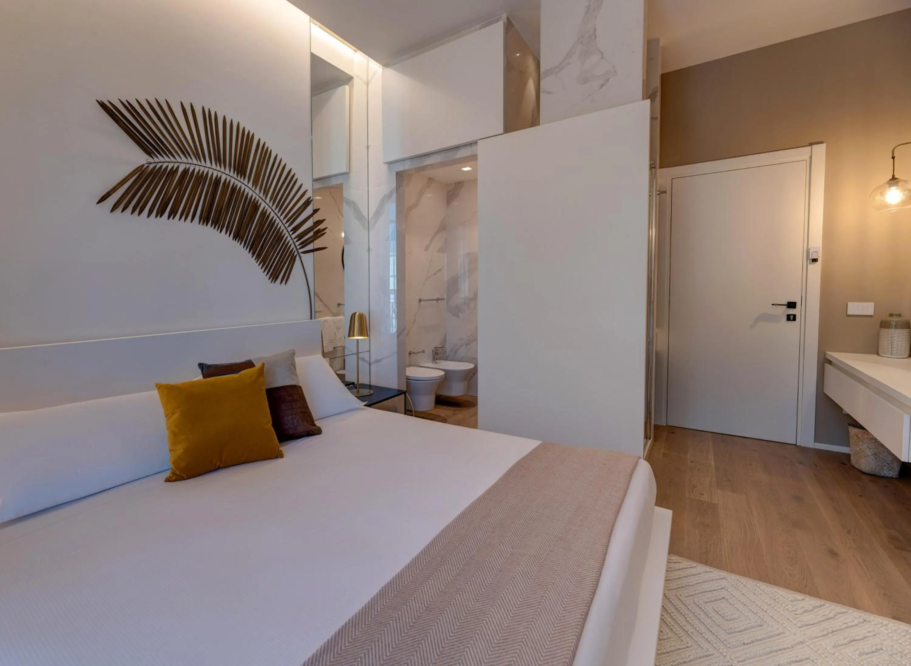 Bed in Le Palmette Suites