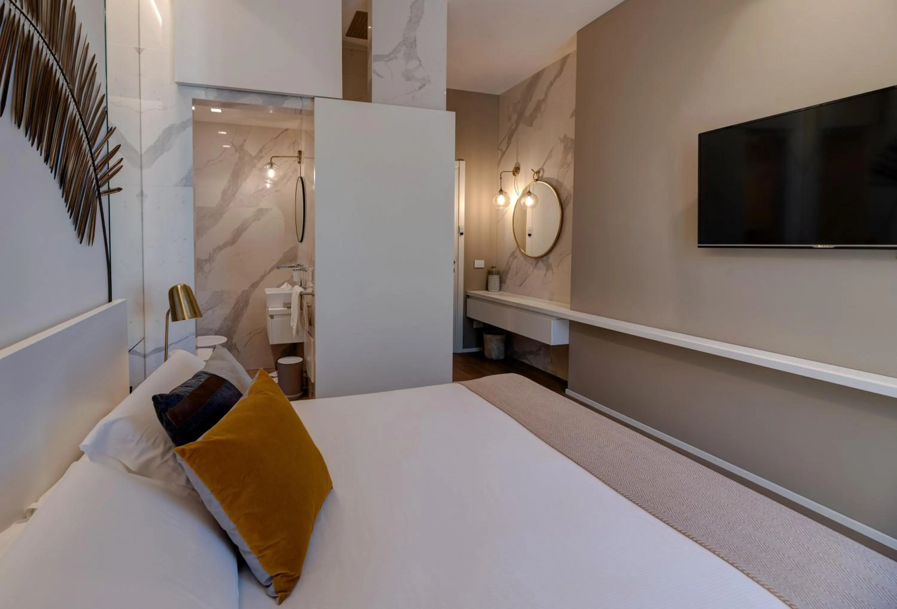 Bed in Le Palmette Suites