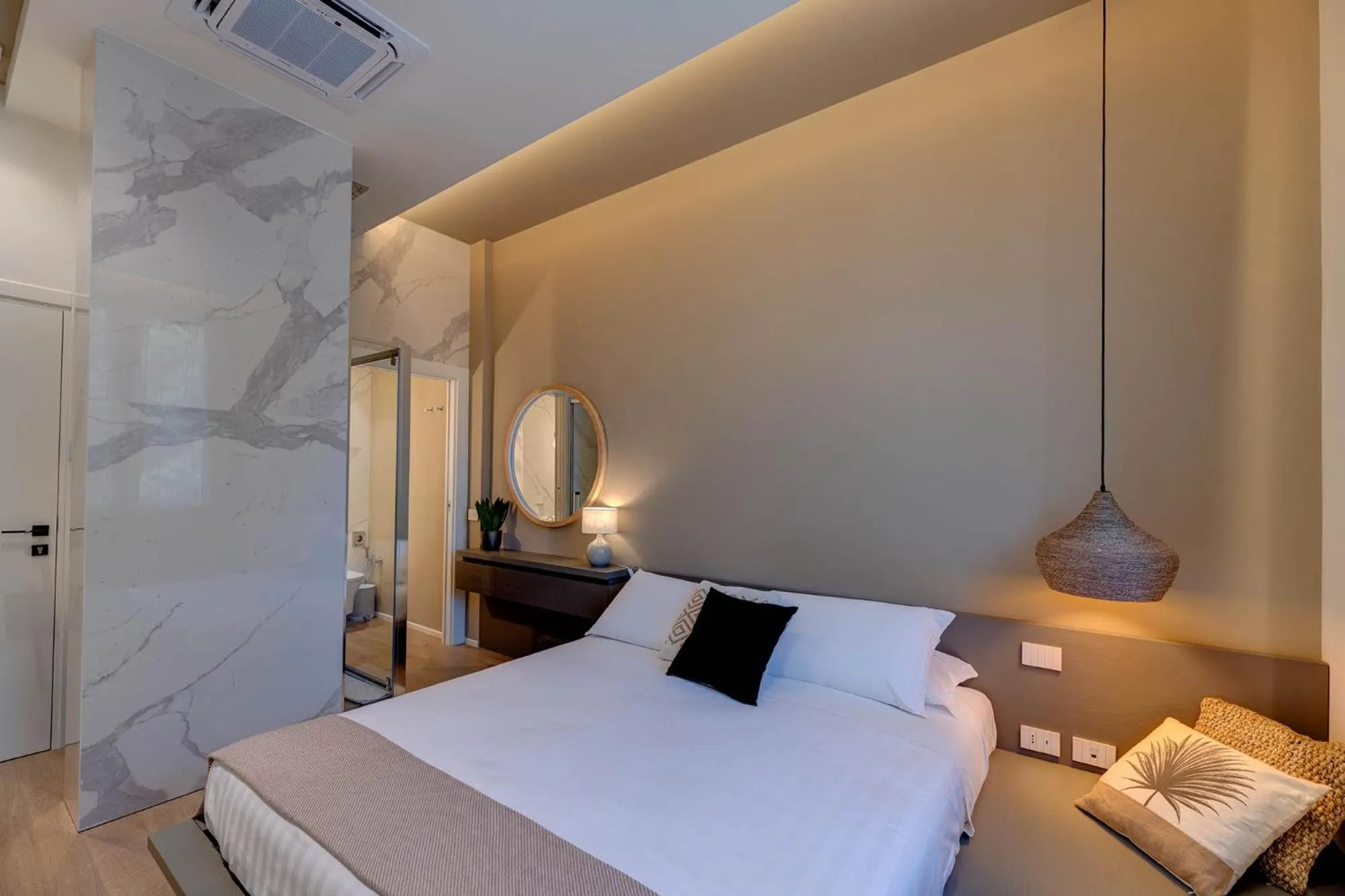 Bed in Le Palmette Suites