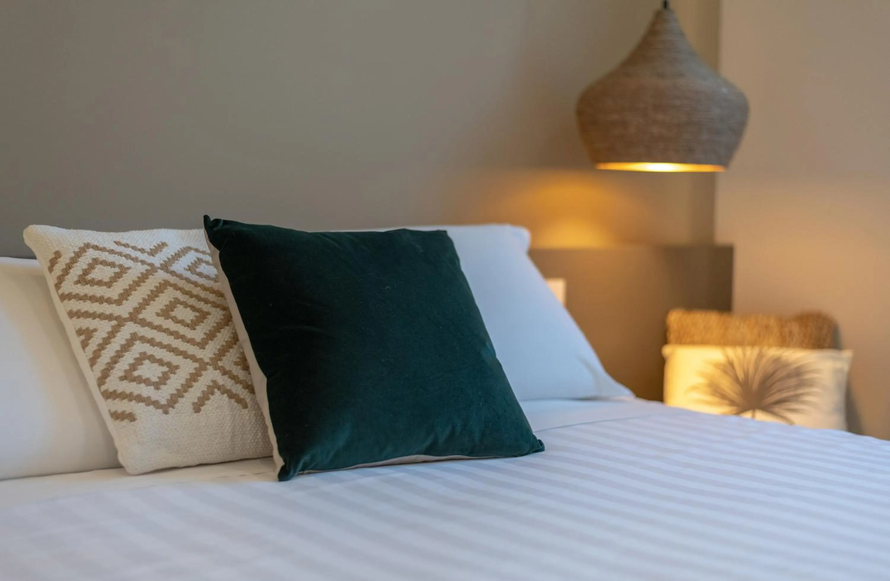 Bed in Le Palmette Suites