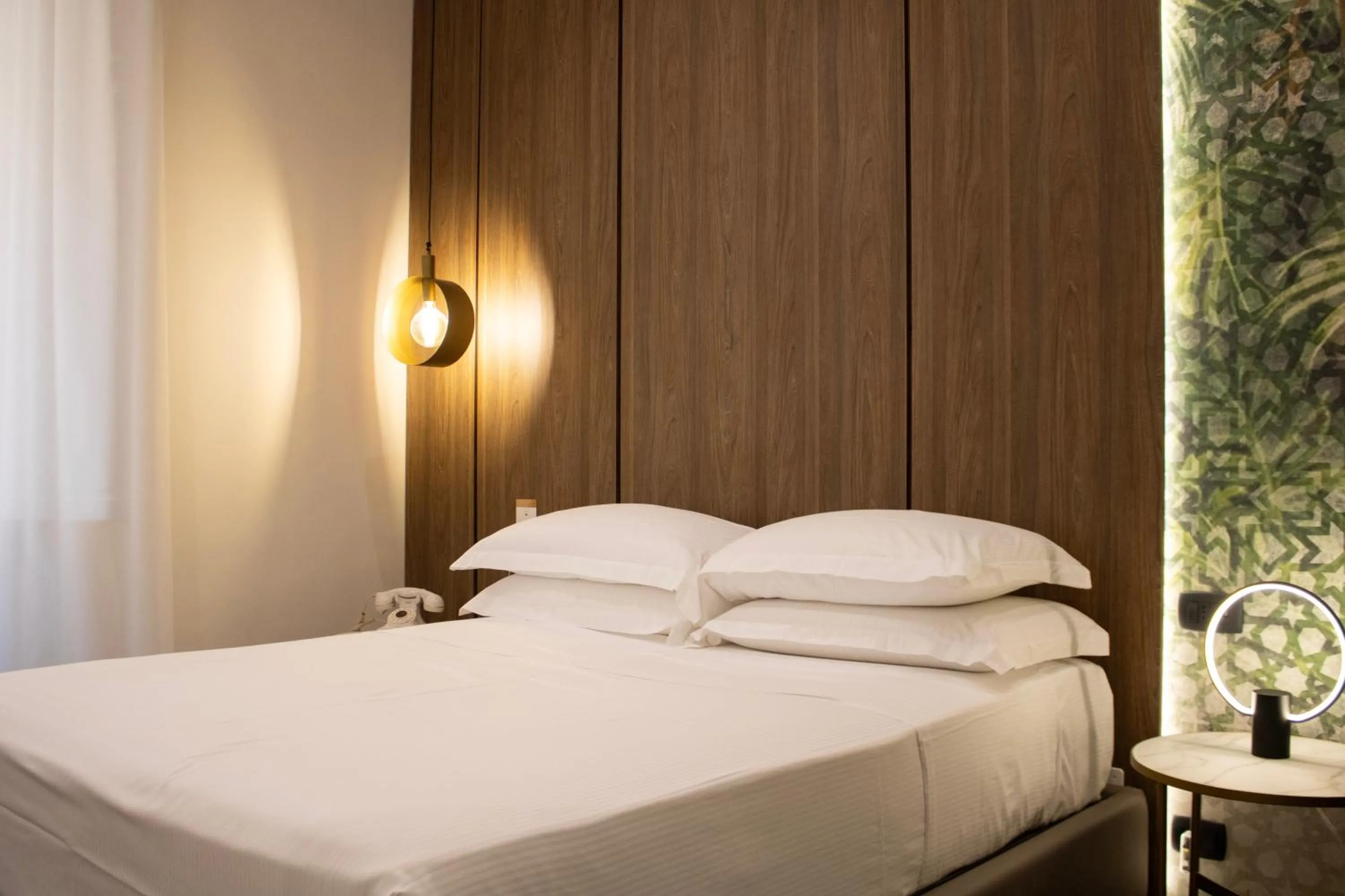 Bed in BADIA NUOVA Apart Hotel