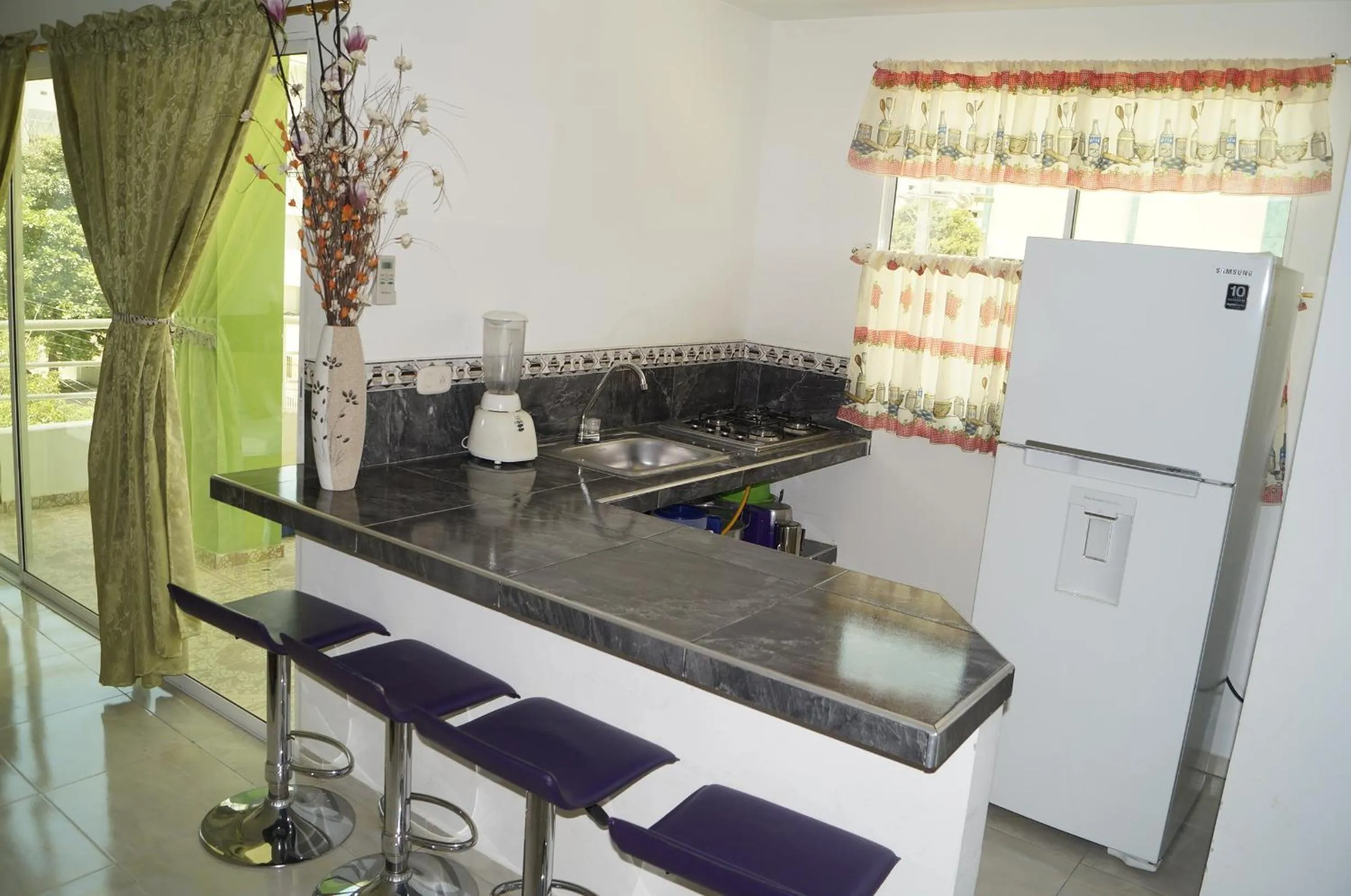 Kitchen or kitchenette in Apartahotel Tukasa Rodadero