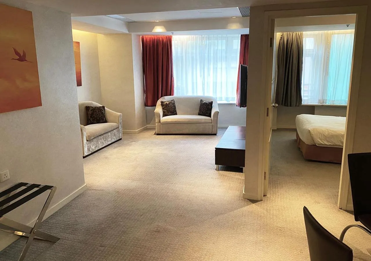 Living room, Bed in Cosmo Hotel Hong Kong