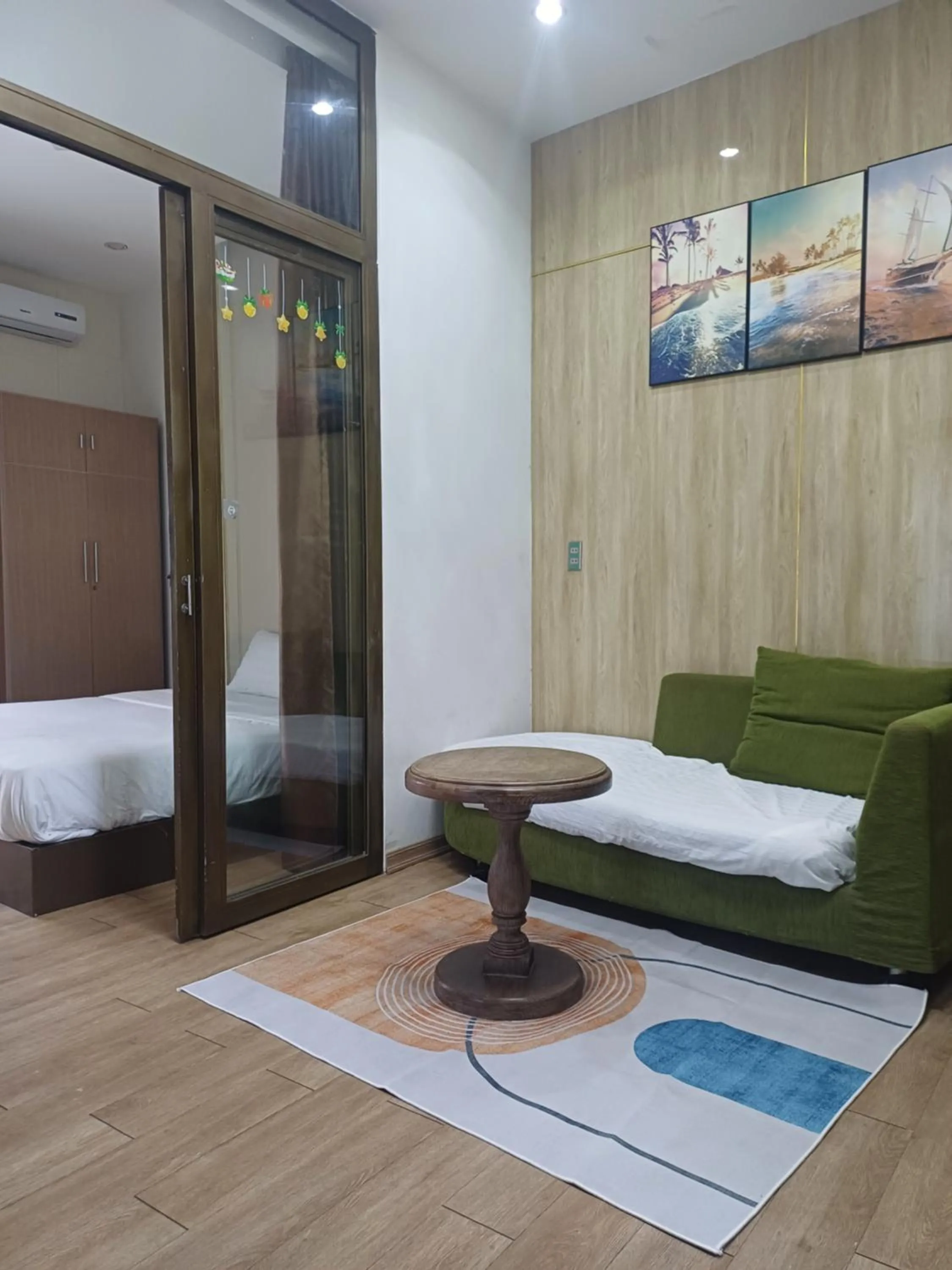 Living room, Bed in Seashine Apartment