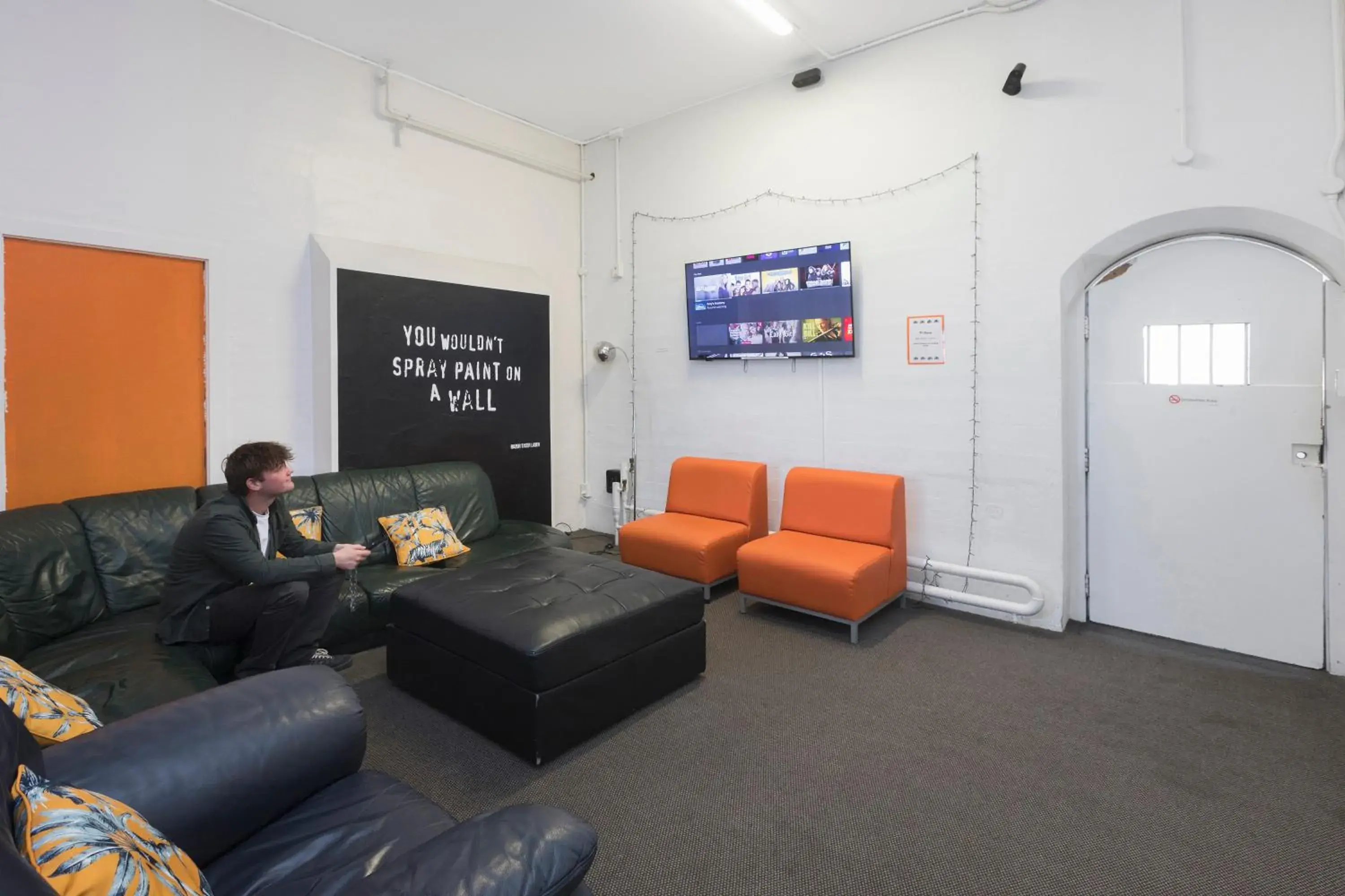 Communal lounge/ TV room, Seating Area in Jailhouse Accommodation