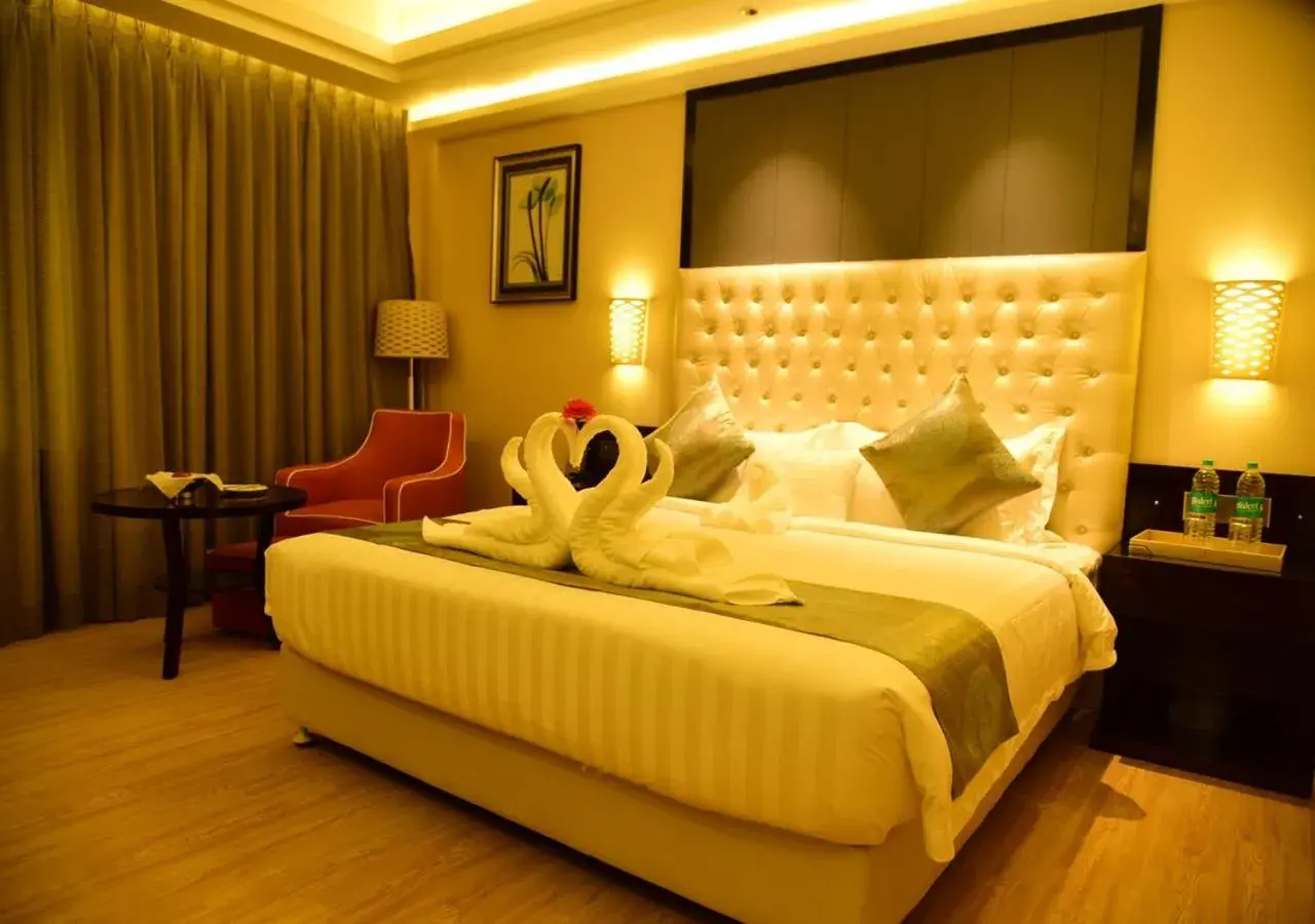 Bedroom, Bed in OM Clarks Inn Raebareli Bedroom, Bed in OM Clarks Inn Raebareli