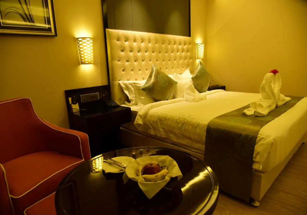 Photo of the whole room, Bed in OM Clarks Inn Raebareli