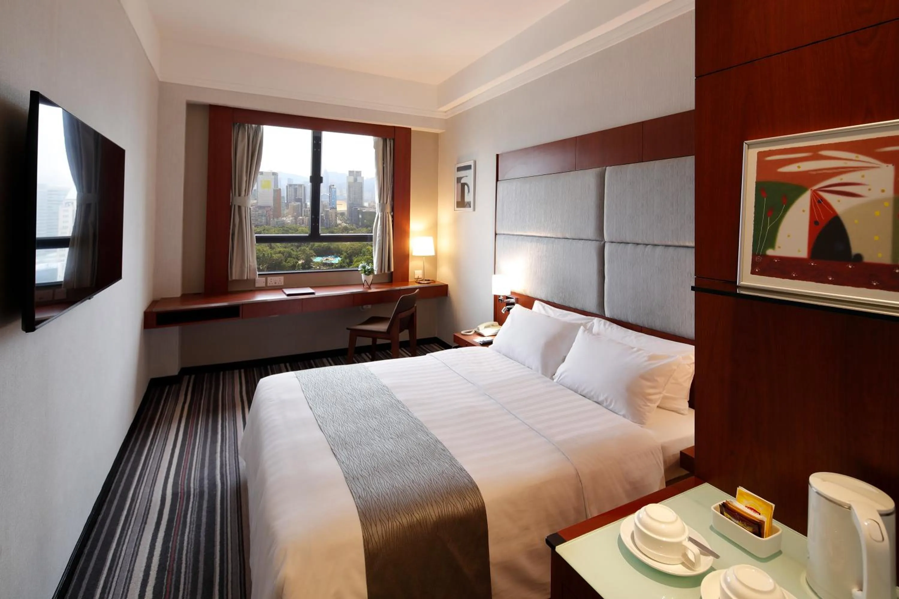 Photo of the whole room, Bed in B P International