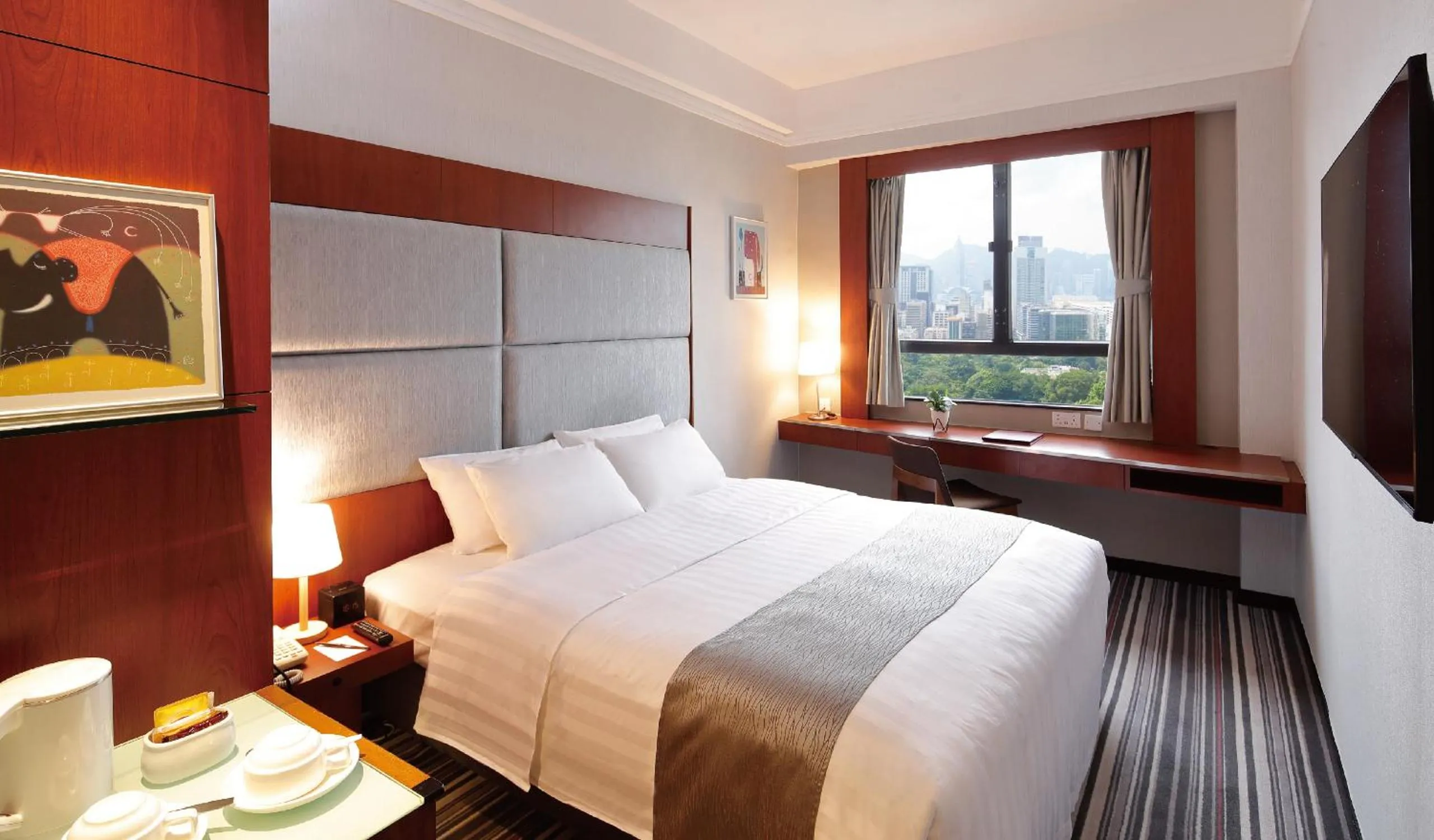 Photo of the whole room, Bed in B P International