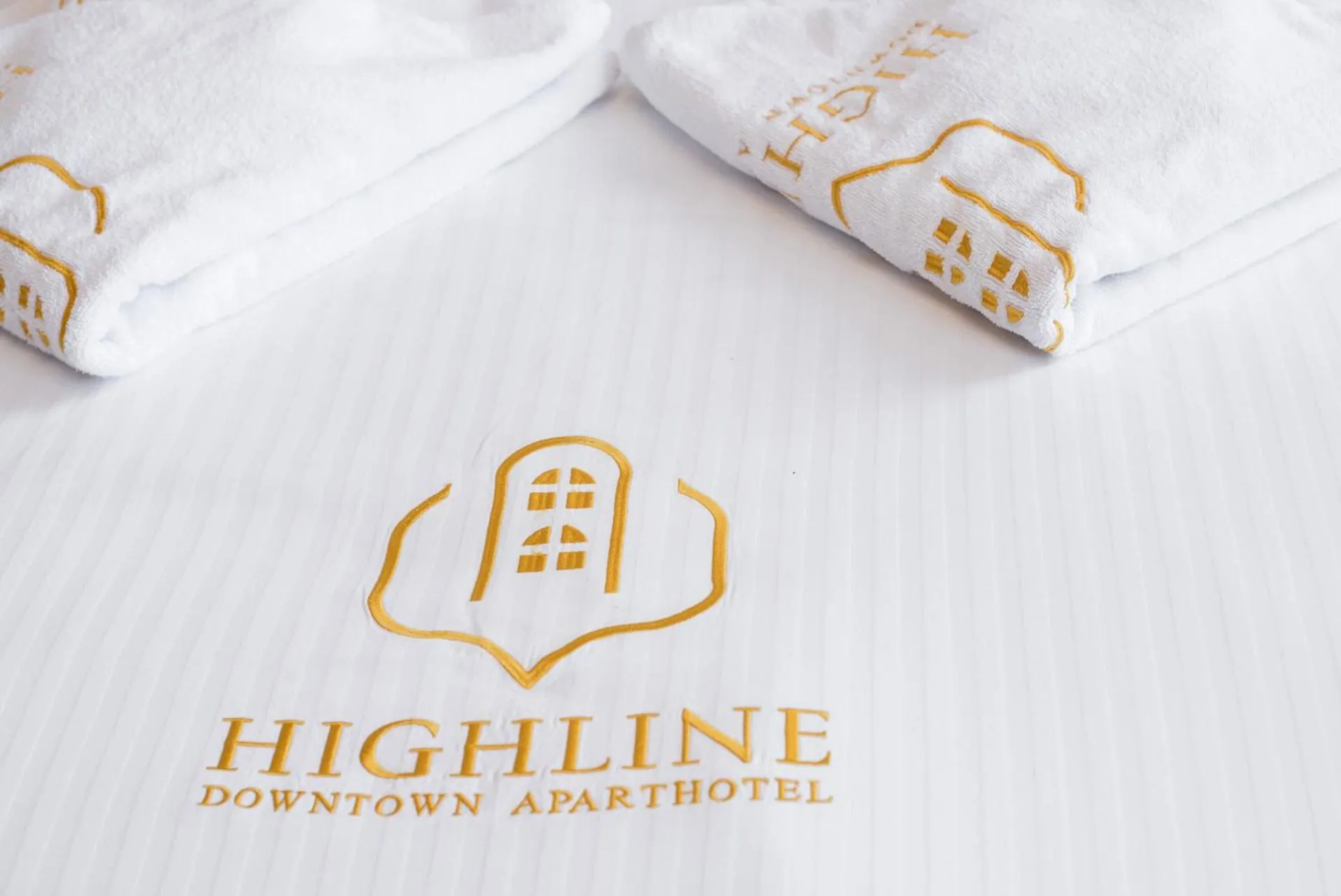 Property logo or sign in HIGHLINE DOWNTOWN ApartHotel OLDTOWN UNIRII SQUARE