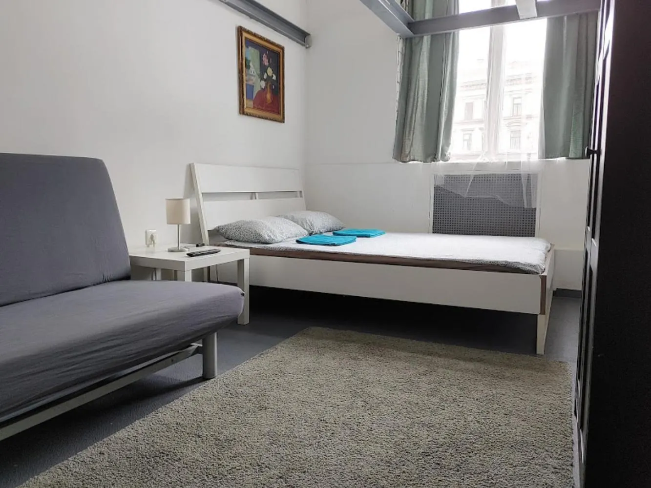 Bed in Sleepover City Center GuestRooms