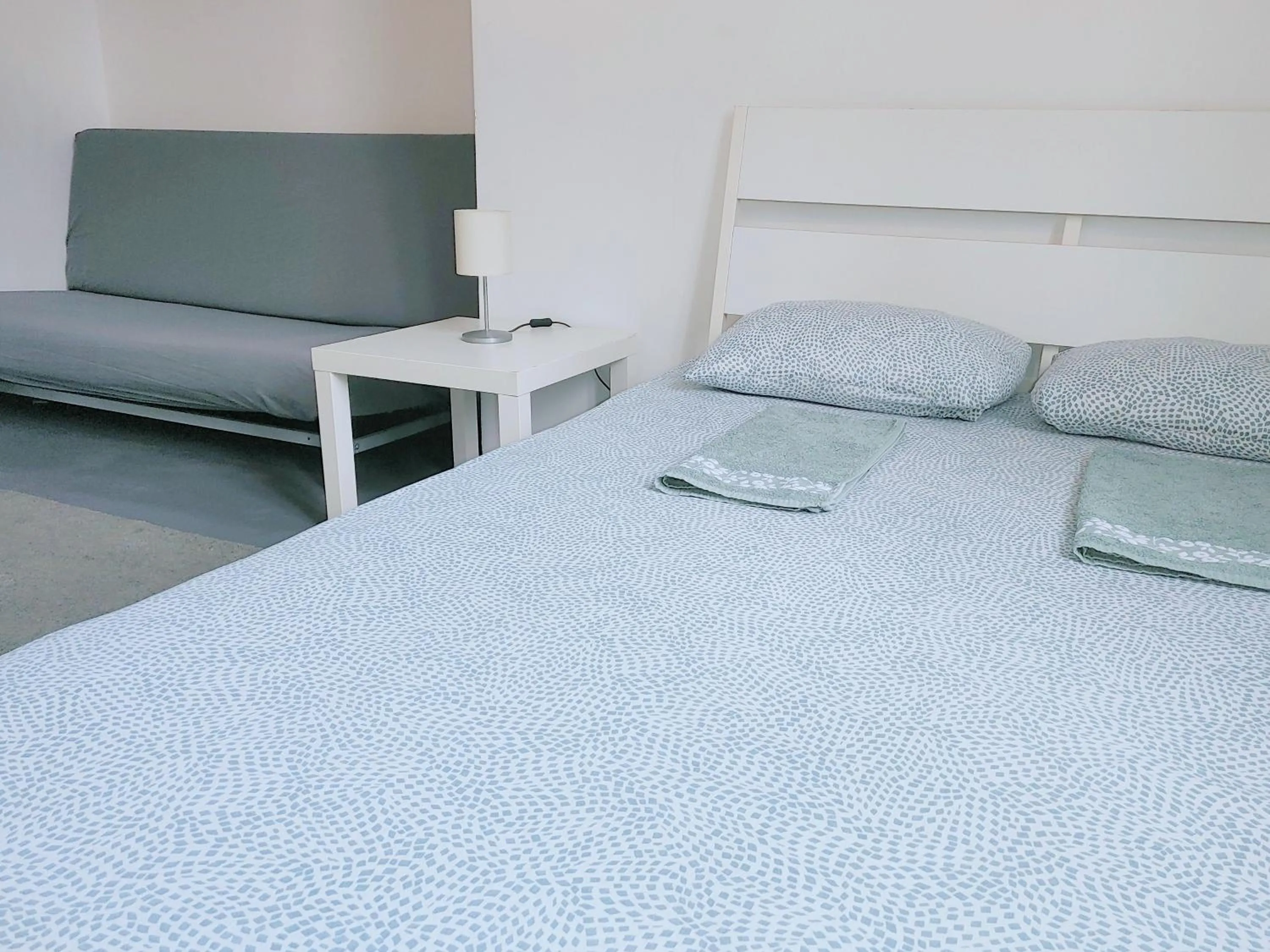 Bed in Sleepover City Center GuestRooms