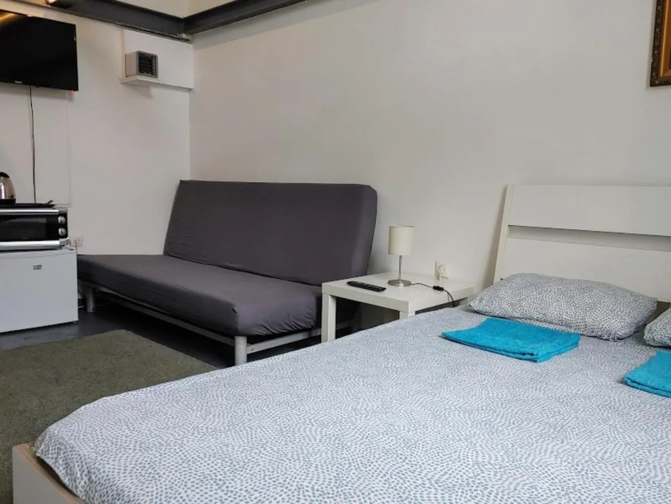 Bed in Sleepover City Center GuestRooms