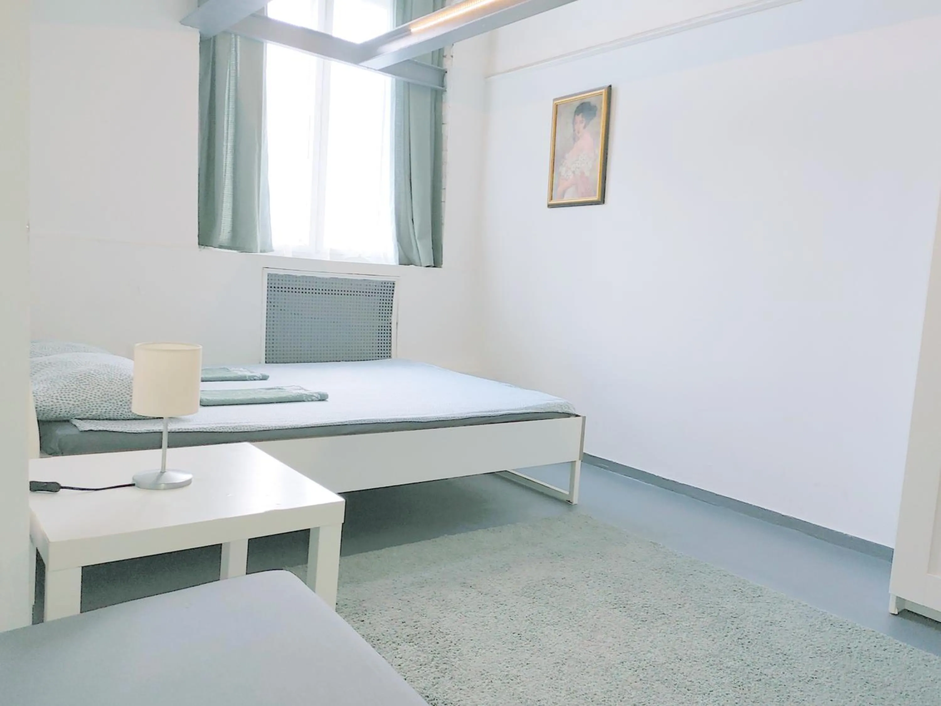 Bed in Sleepover City Center GuestRooms