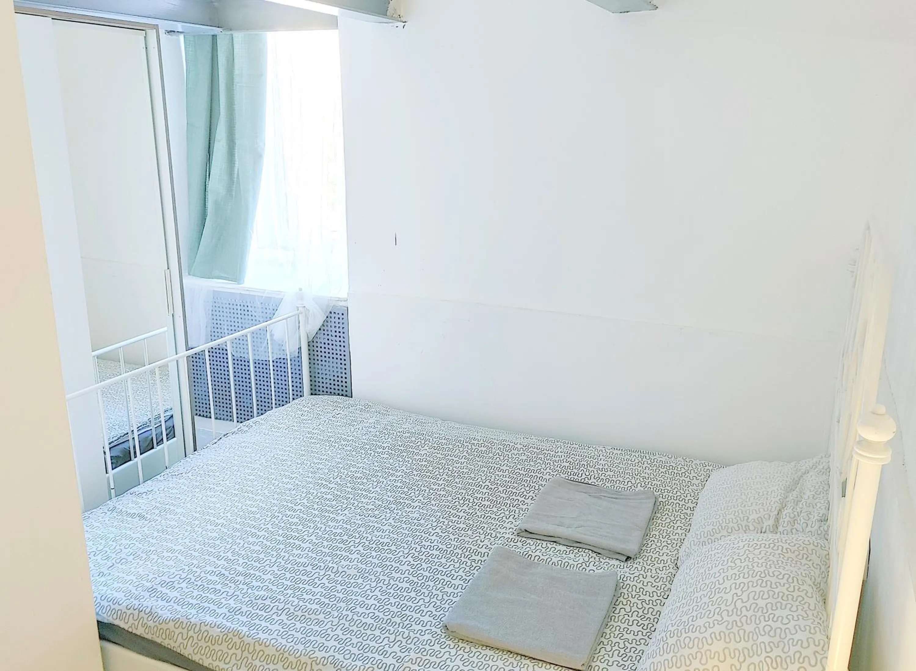 Bed in Sleepover City Center GuestRooms