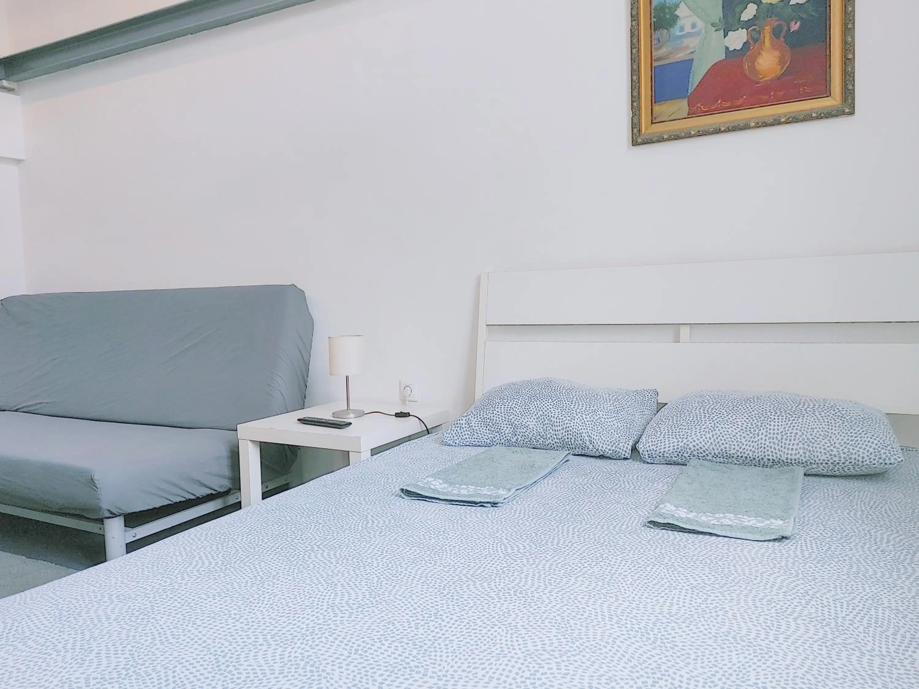 Bed in Sleepover City Center GuestRooms